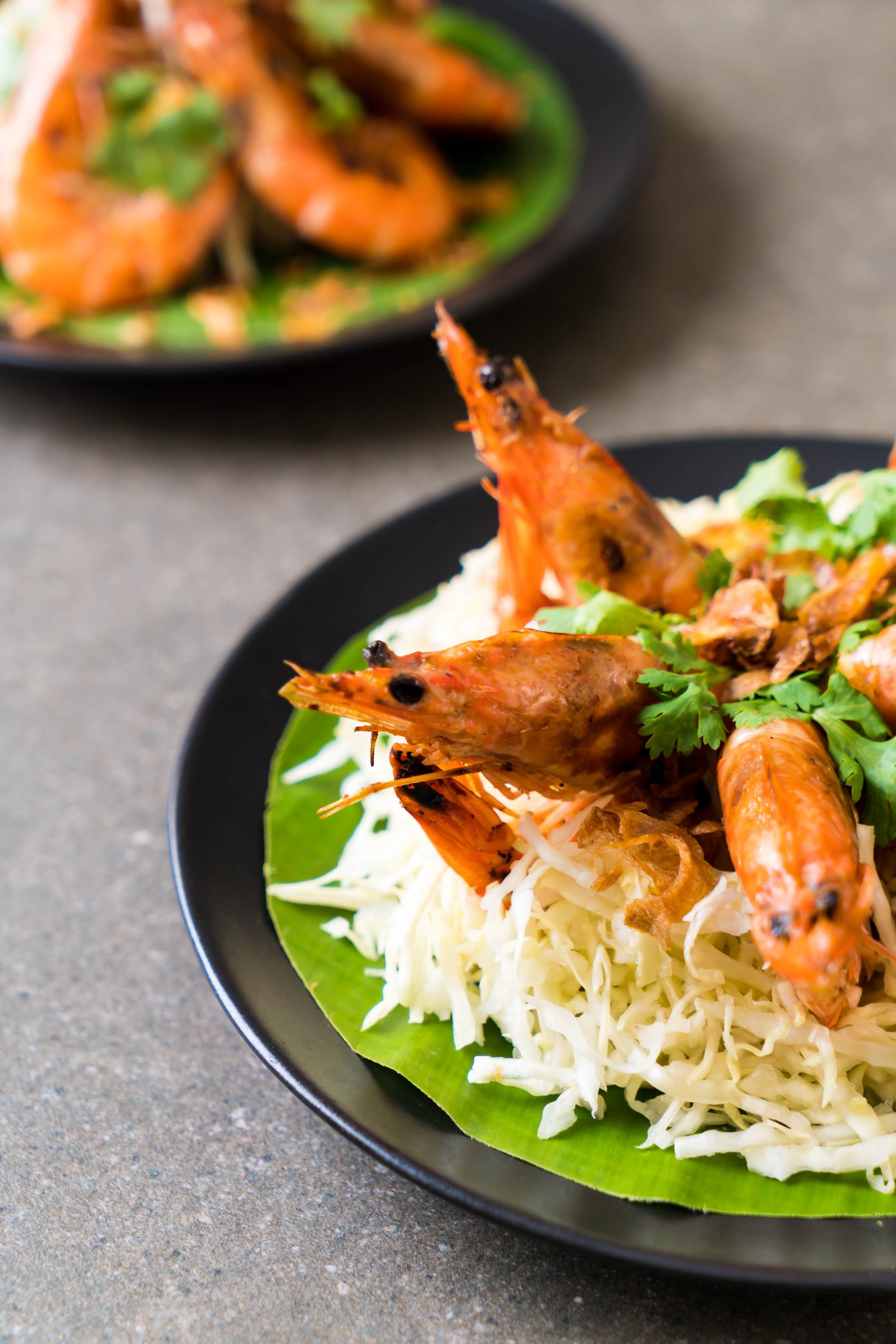 Overhead flat-lay of all ingredients for Jamaican Coconut Milk Fried Rice with Spicy Jerk Shrimp laid out on a kitchen surface.