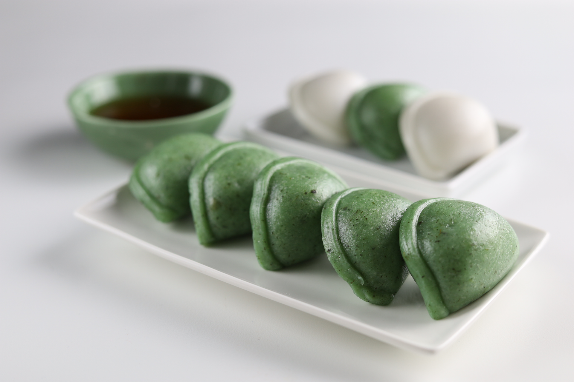 Overhead flat-lay of all ingredients for Japanese Green Tea Mochi with Red Bean Center laid out on a kitchen surface.