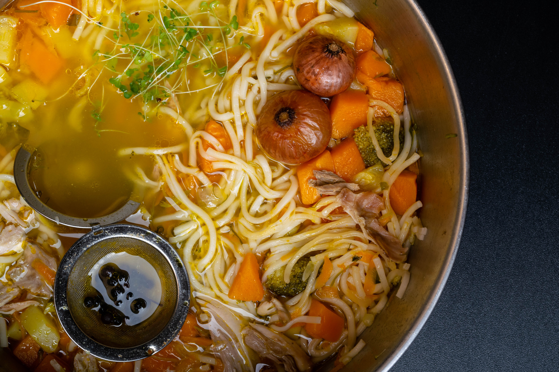 Overhead flat-lay of all ingredients for Japanese Hōtō Noodles in Miso Broth with Pumpkin laid out on a kitchen surface.