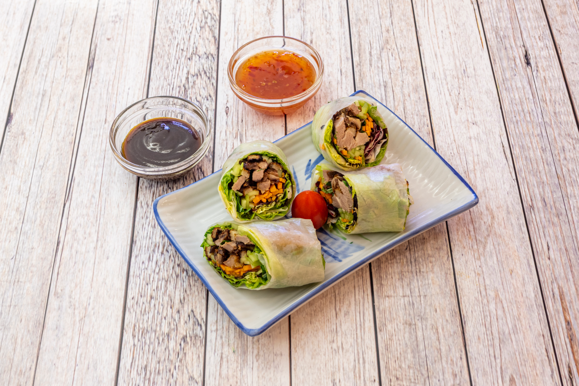 Overhead flat-lay of all ingredients for Japanese Keto-Friendly Pork Lettuce Wraps with Spicy Miso Sauce laid out on a kitchen surface.