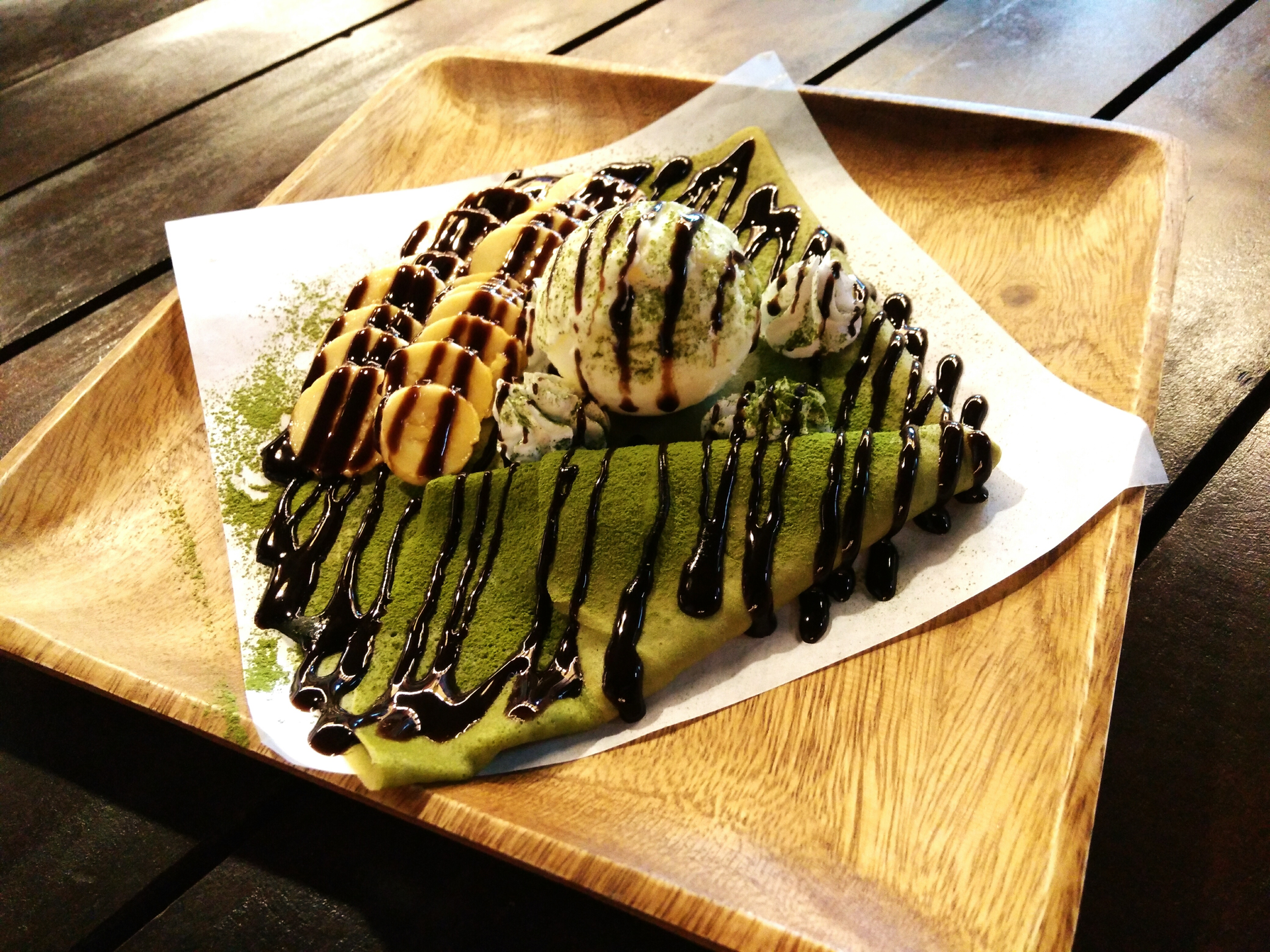 Overhead flat-lay of all ingredients for Japanese Matcha Crepes with Red Bean Mousse laid out on a kitchen surface.