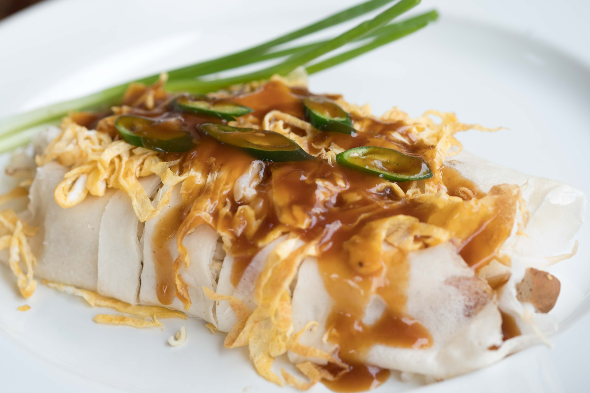 Overhead flat-lay of all ingredients for Japanese Miso Butter Cod with Enoki Mushrooms laid out on a kitchen surface.
