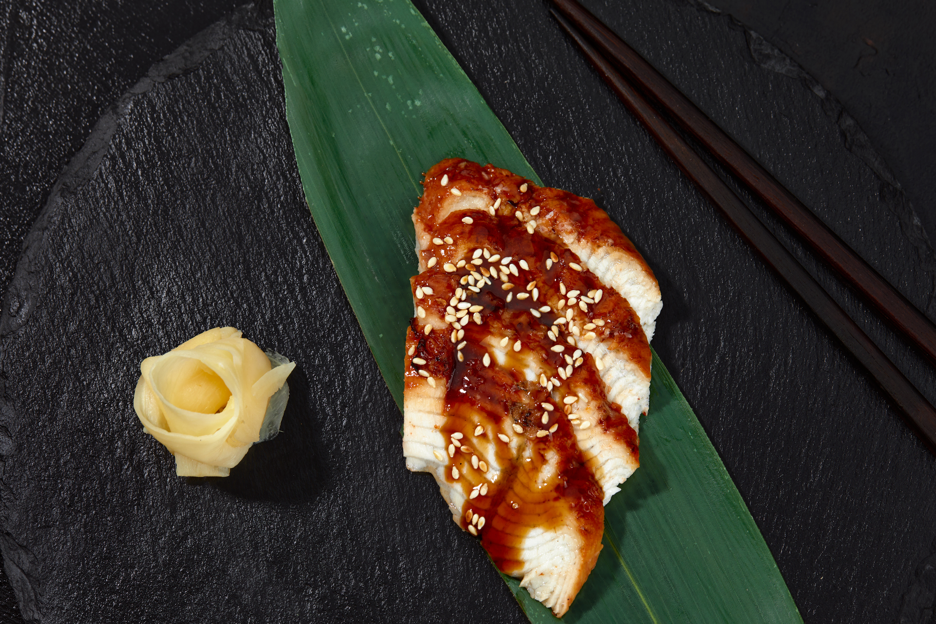 Overhead flat-lay of all ingredients for Japanese Misoyaki Black Cod with Pickled Ginger laid out on a kitchen surface.