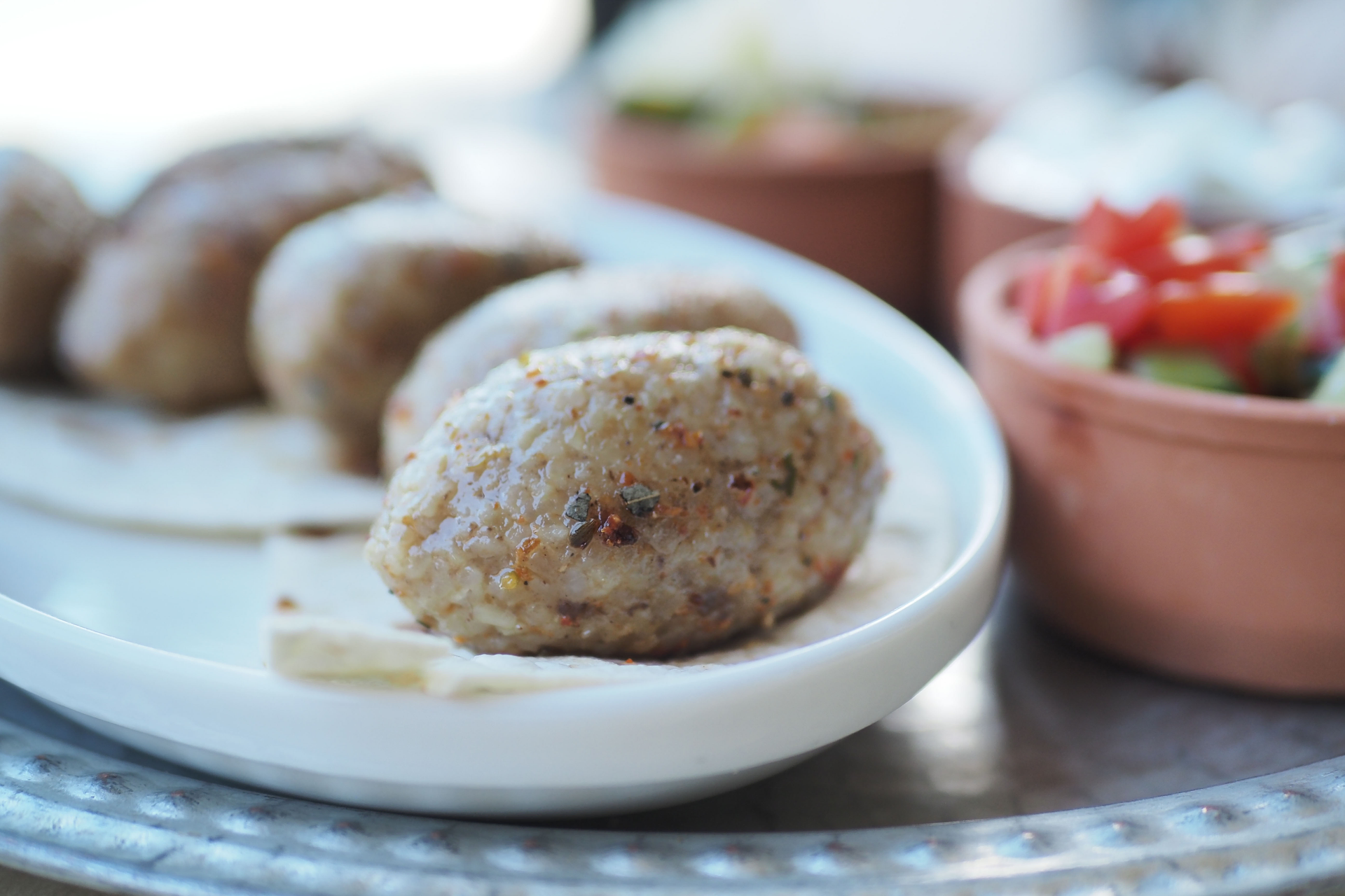 Kibbeh Bil Sanieh with Tahini Sauce — Middle Eastern served and photographed from above