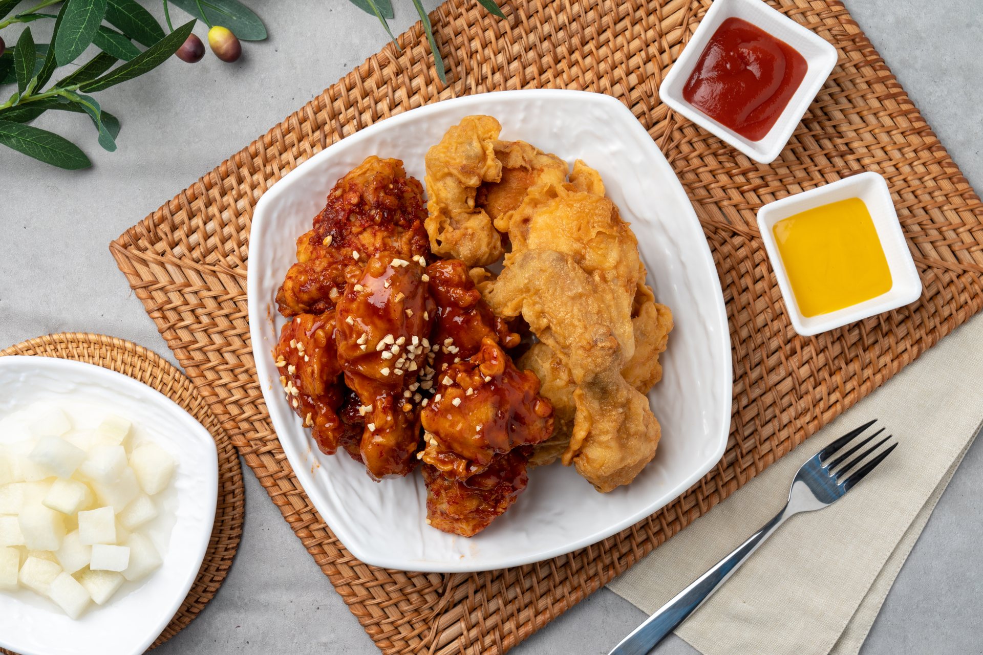 Overhead flat-lay of all ingredients for Korean Honey Butter Fried Chicken laid out on a kitchen surface.