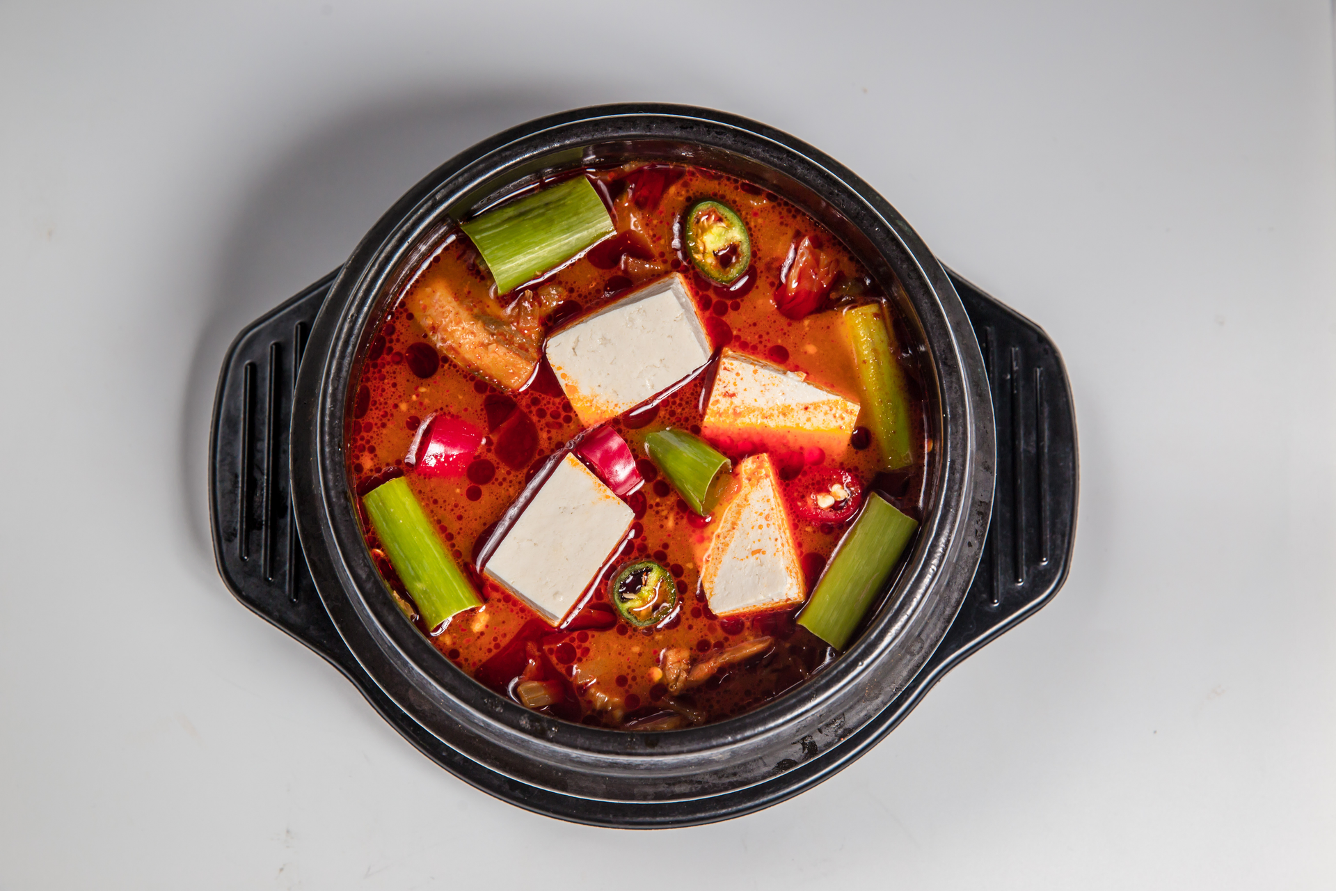 Korean Kimchi and Pork Hotpot with Silken Tofu — Main Course served and photographed from above