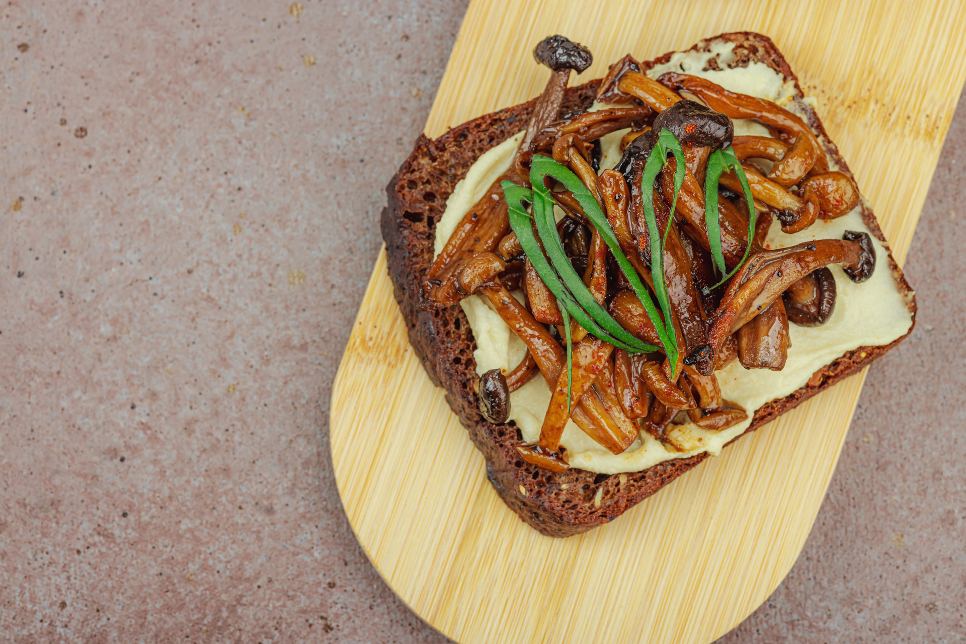 Overhead flat-lay of all ingredients for Korean Kimchi Cheesesteak with Bulgogi Beef laid out on a kitchen surface.