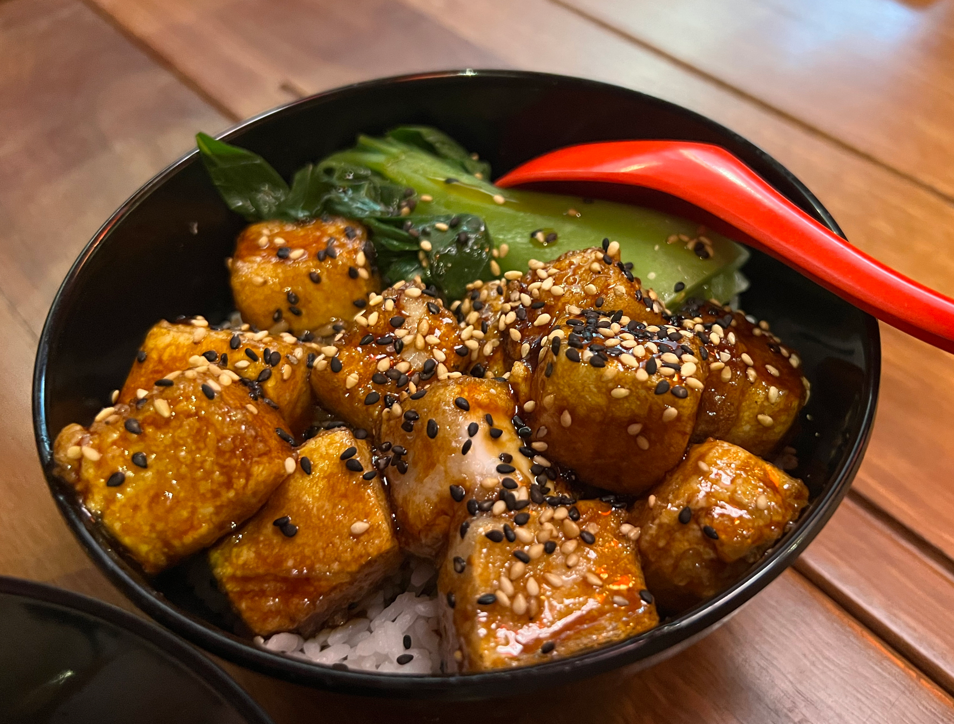 Overhead flat-lay of all ingredients for Korean Sesame-Crusted Tofu with Kimchi Slaw and Chili Sauce laid out on a kitchen surface.