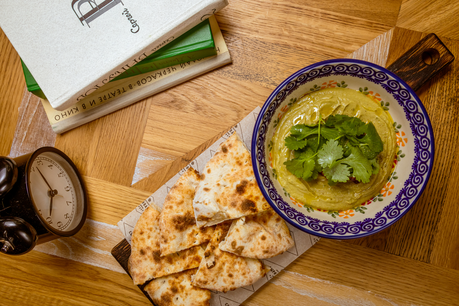 Overhead flat-lay of all ingredients for Lebanese Lentil and Spinach Soup with Pita Chips laid out on a kitchen surface.