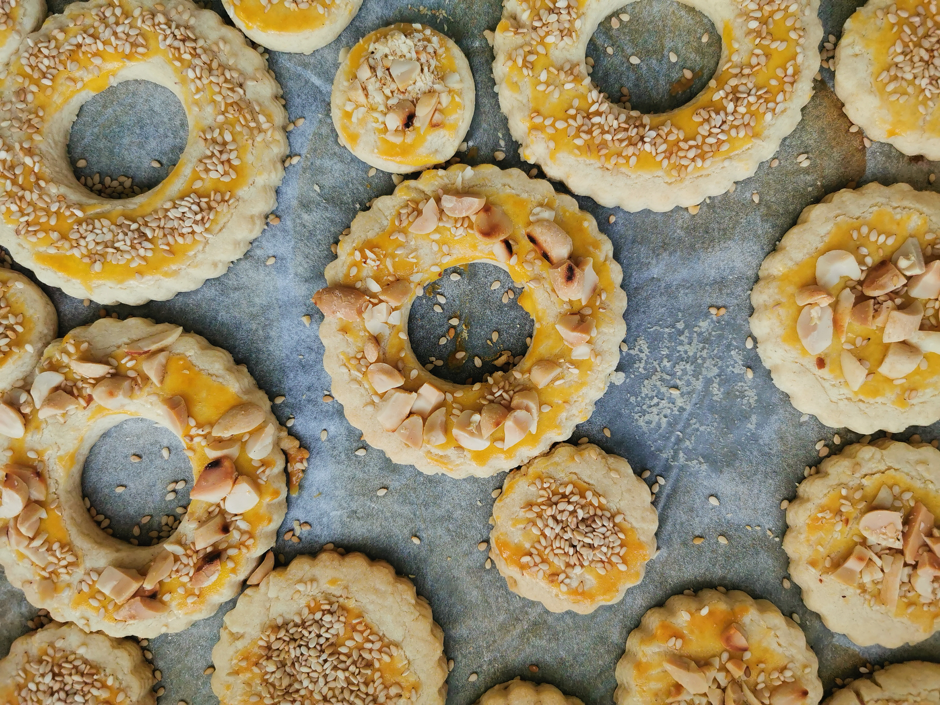 Overhead flat-lay of all ingredients for Lebanese Maamoul Pastry with Date and Nut Filling laid out on a kitchen surface.