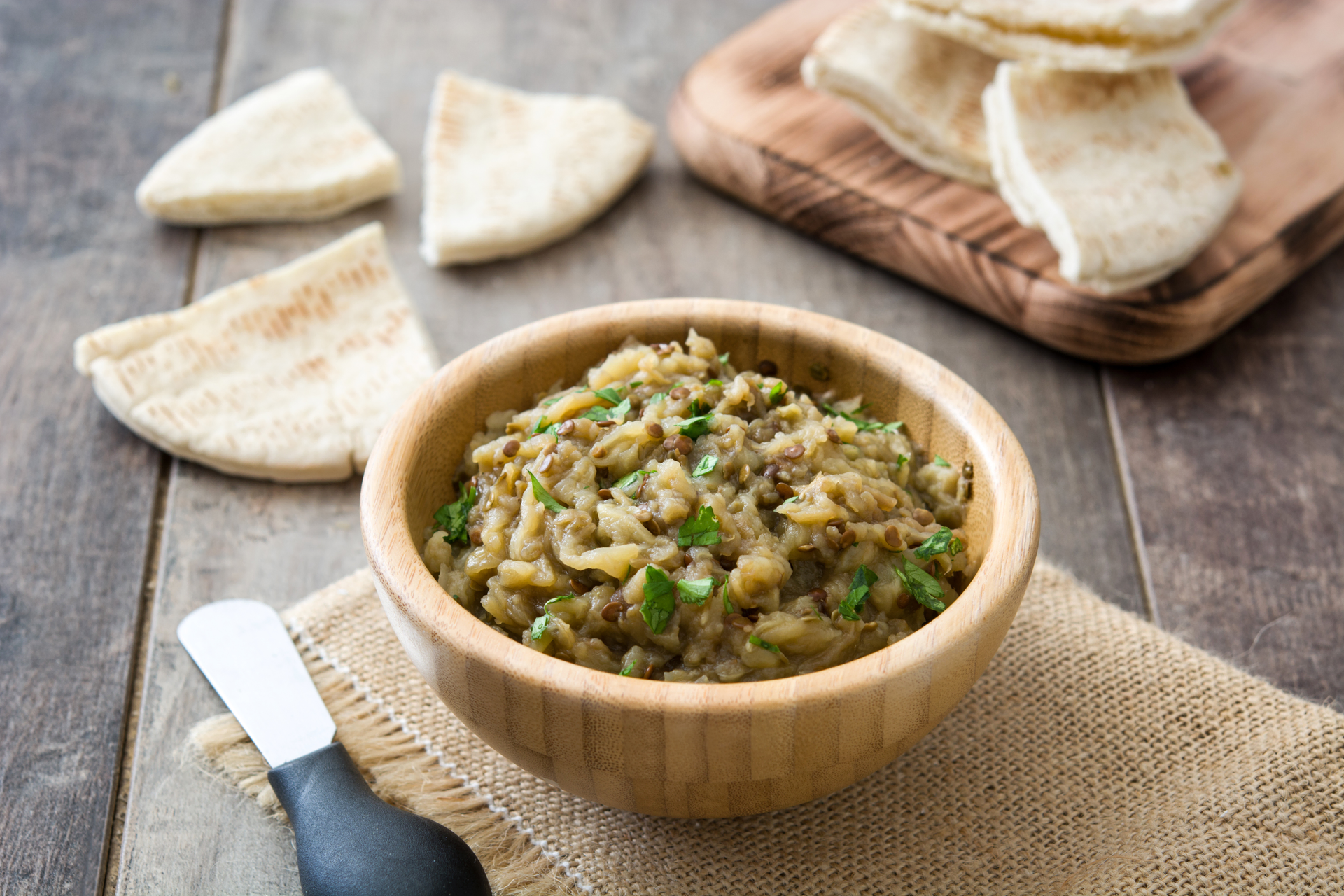 Overhead flat-lay of all ingredients for Lebanese Rishta with Lentils and Caramelized Onions laid out on a kitchen surface.