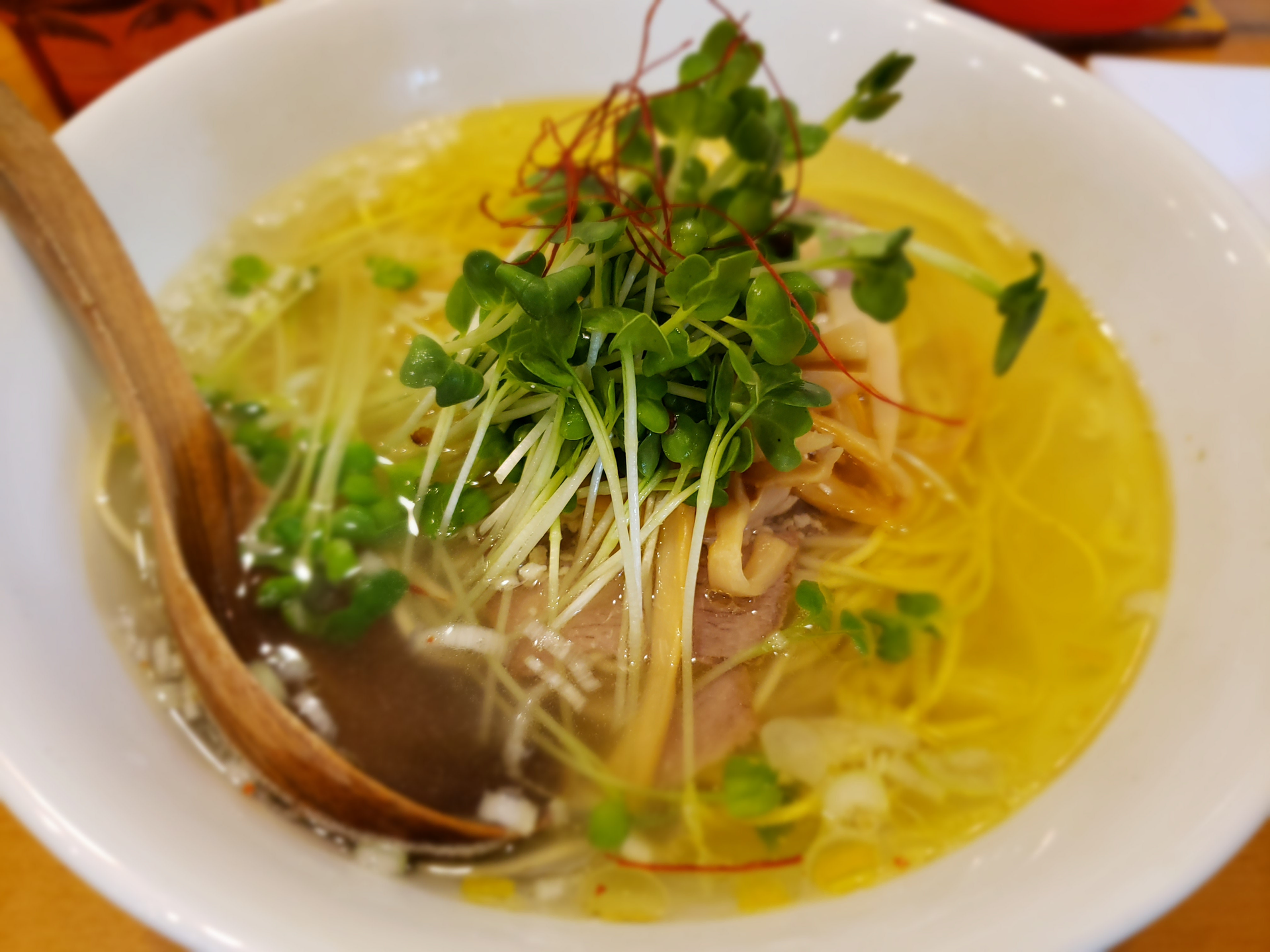 Overhead flat-lay of all ingredients for Lemon-Basil Vietnamese Pho with Herb-Infused Broth laid out on a kitchen surface.