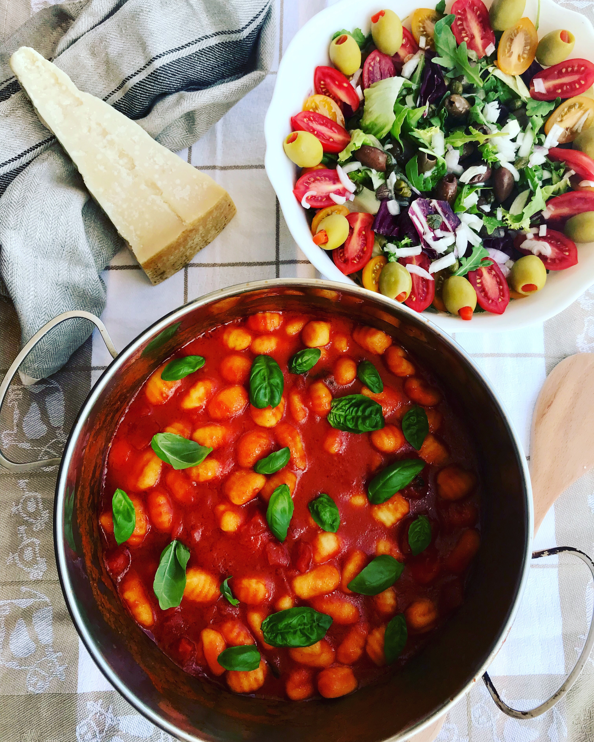 Overhead flat-lay of all ingredients for Lemony Greek Fasolakia Stew with Fresh Tomatoes laid out on a kitchen surface.