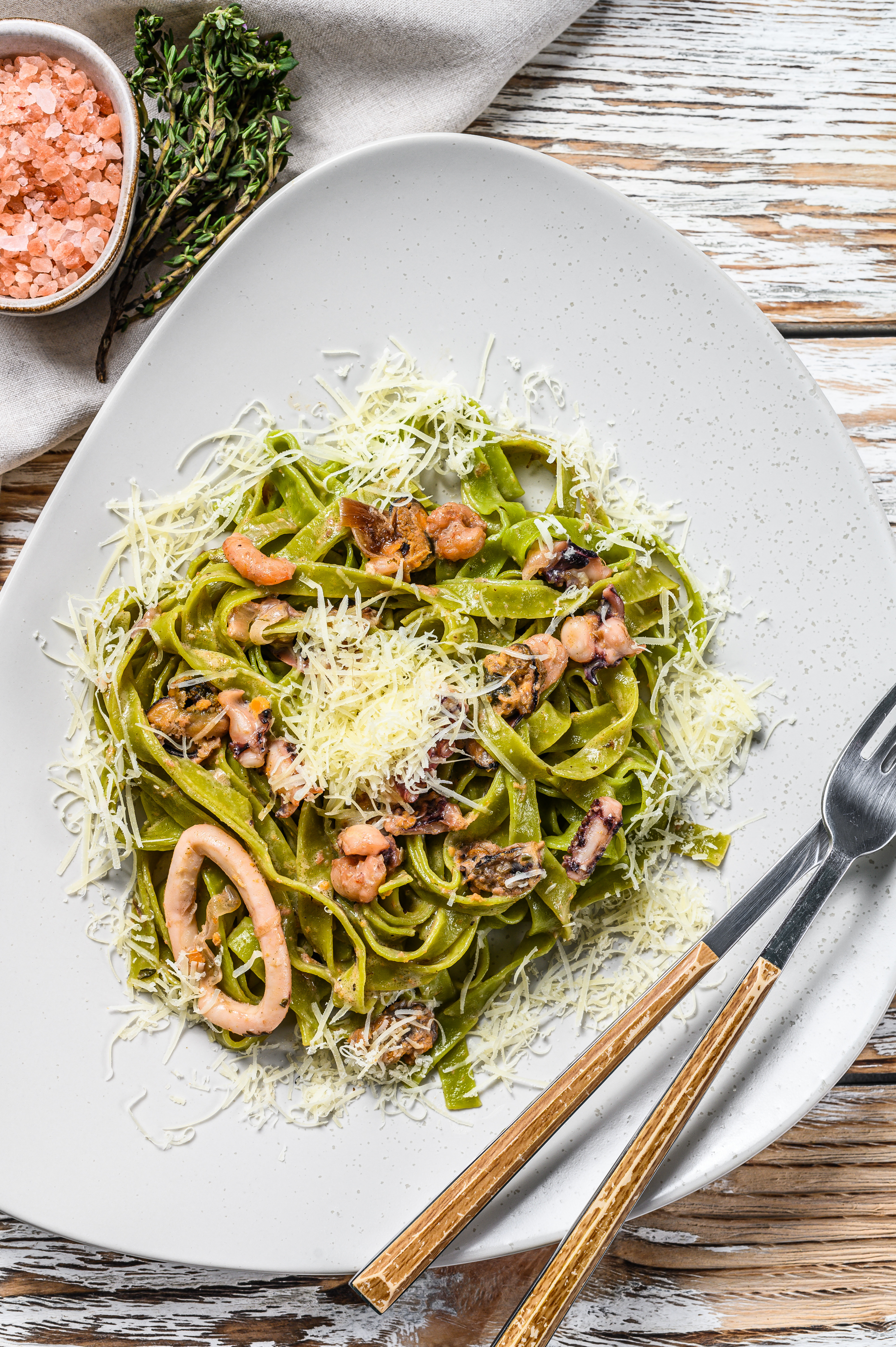 Overhead flat-lay of all ingredients for Lemony Italian Scialatielli with Seafood and Fresh Basil laid out on a kitchen surface.