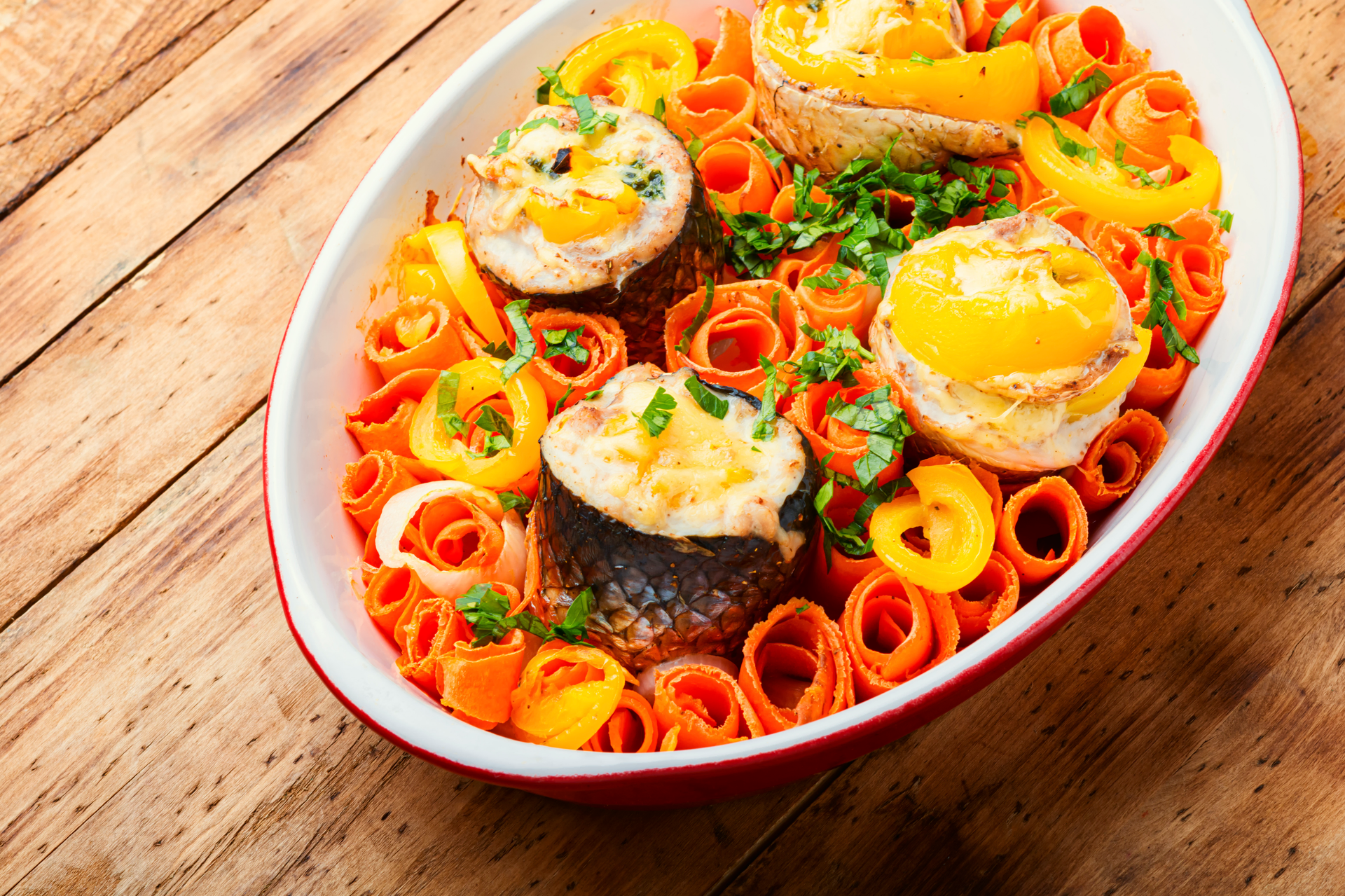 Overhead flat-lay of all ingredients for Lemony Portuguese Caldeirada with Seafood Medley laid out on a kitchen surface.