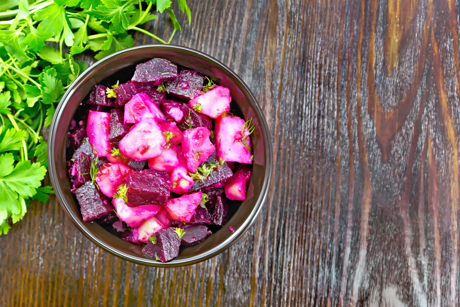 Overhead flat-lay of all ingredients for Luminous Ethiopian Beetroot Salad with Berbere Spice and Mint laid out on a kitchen surface.