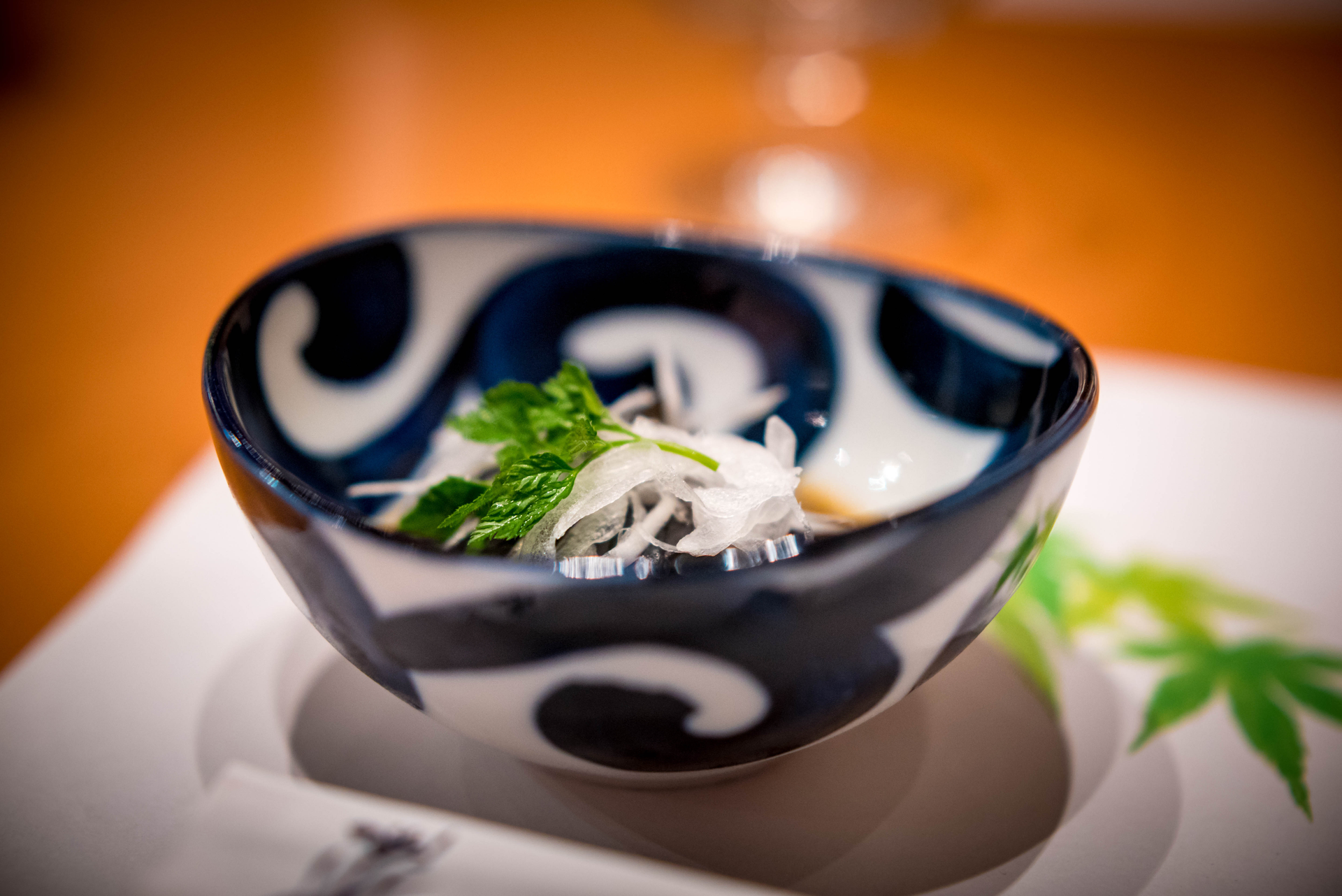 Overhead flat-lay of all ingredients for Luminous Japanese Udon Bowl with Miso-Ginger Broth and Seaweed laid out on a kitchen surface.