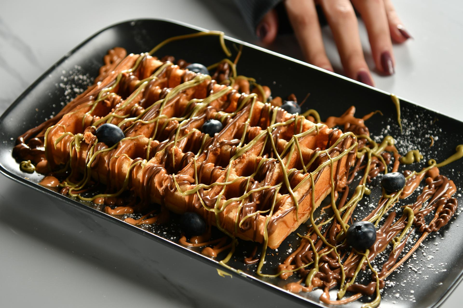 Overhead flat-lay of all ingredients for Luscious Belgian Liege Waffles with Pearl Sugar Crust laid out on a kitchen surface.