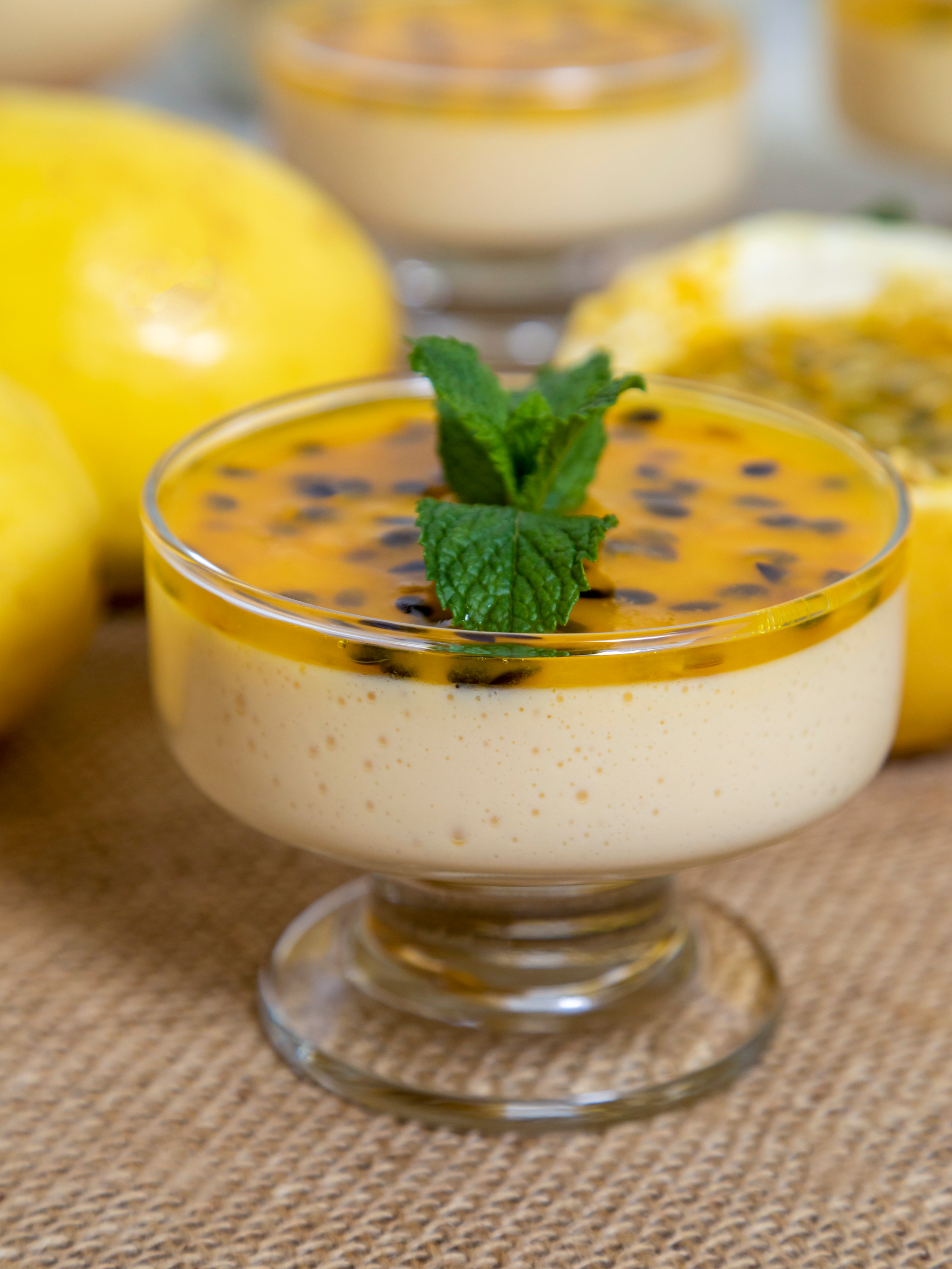 Overhead flat-lay of all ingredients for Luscious Brazilian Mango Mousse with Guava Sauce laid out on a kitchen surface.