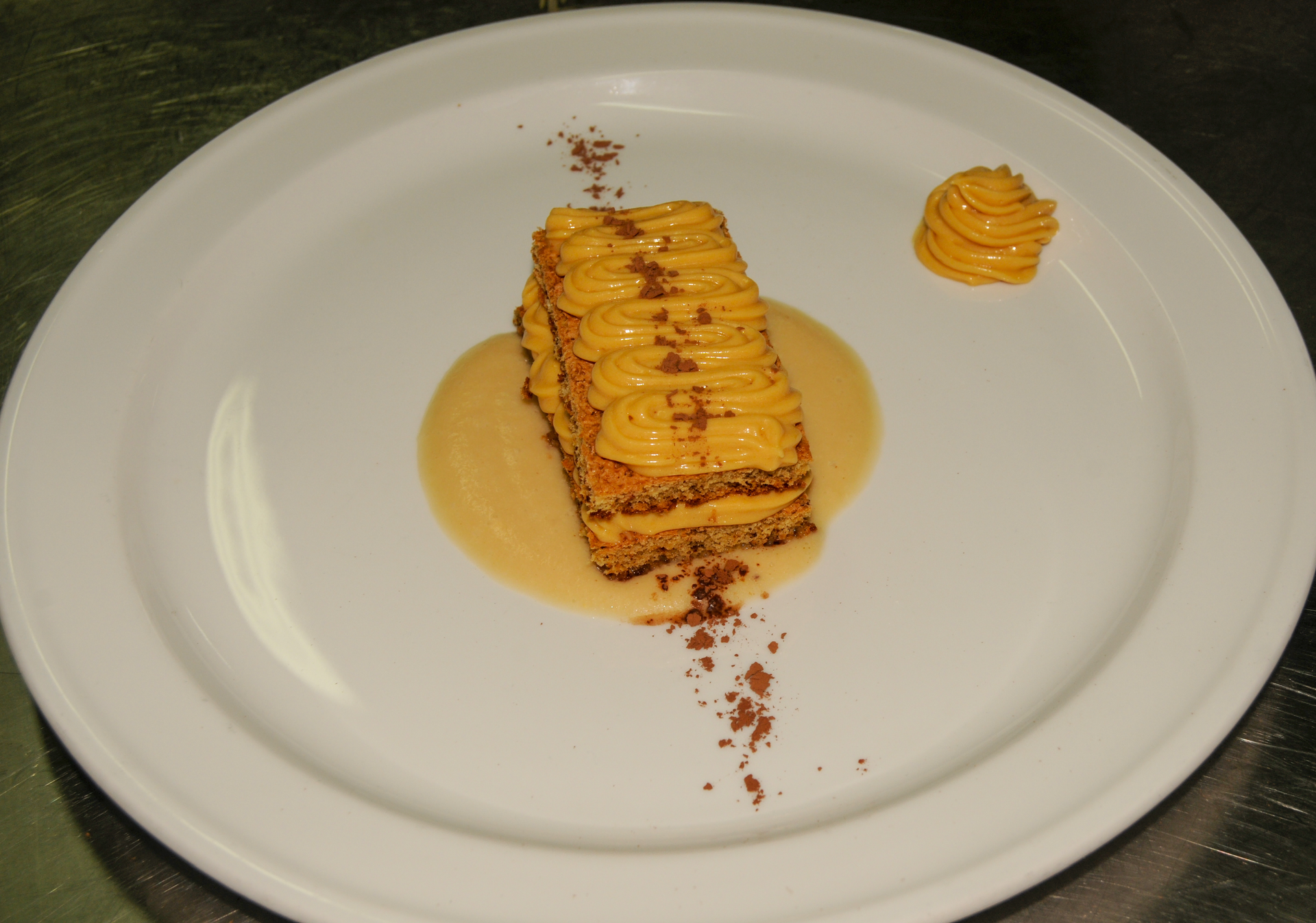 Overhead flat-lay of all ingredients for Lush Greek Baklava Cheesecake with Honey Syrup Drizzle laid out on a kitchen surface.