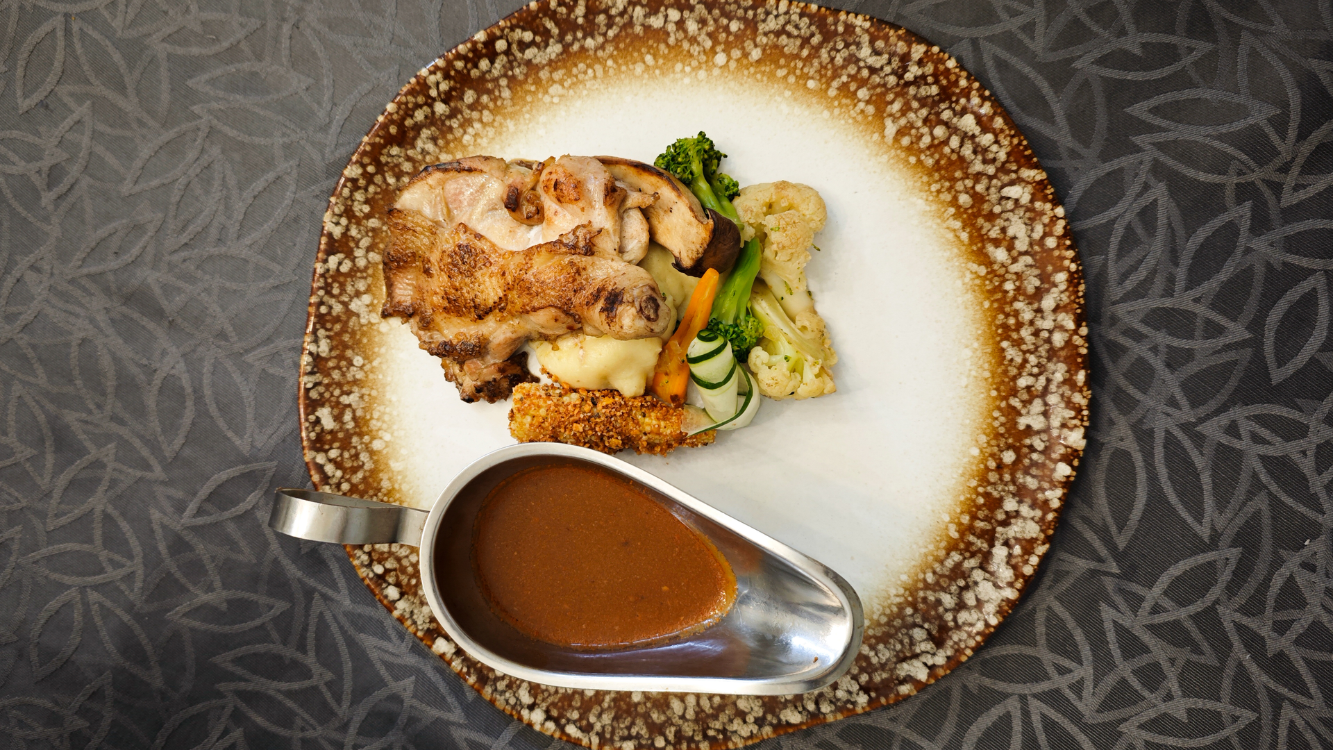 Overhead flat-lay of all ingredients for Luxurious Emirati Harees with Slow-Cooked Chicken and Wheat laid out on a kitchen surface.