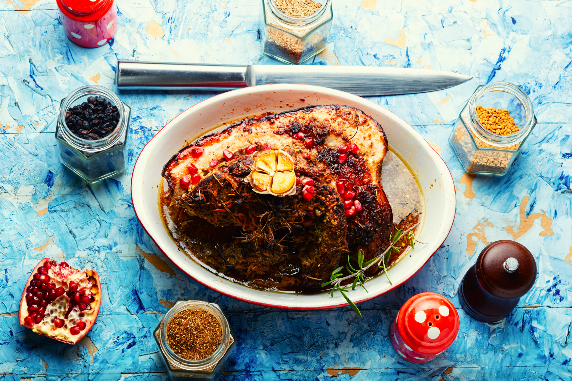 Overhead flat-lay of all ingredients for Luxurious Moroccan Lamb Tagine with Prunes and Almonds laid out on a kitchen surface.