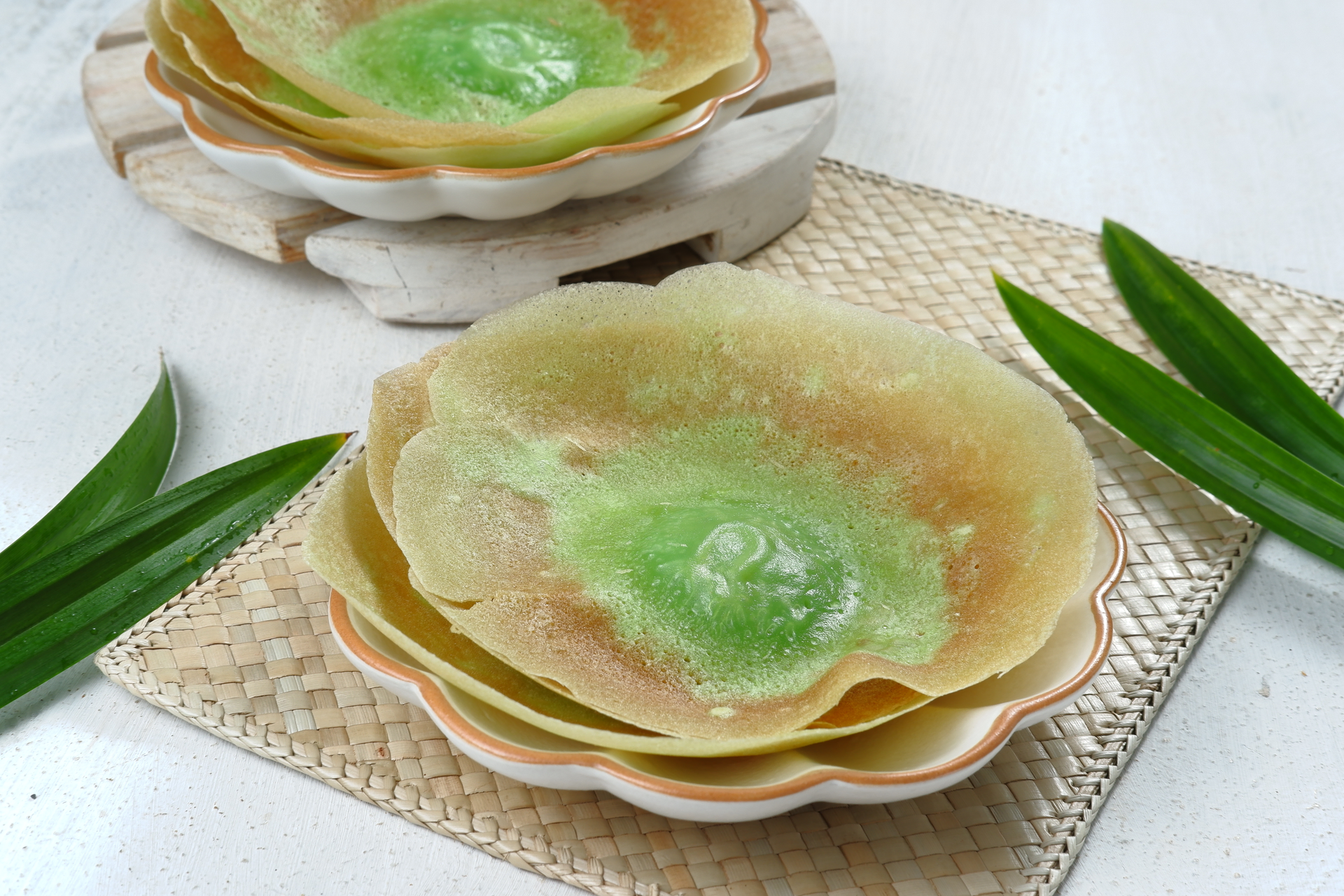 Overhead flat-lay of all ingredients for Malaysian Pandan Pancakes with Coconut Pastilla laid out on a kitchen surface.