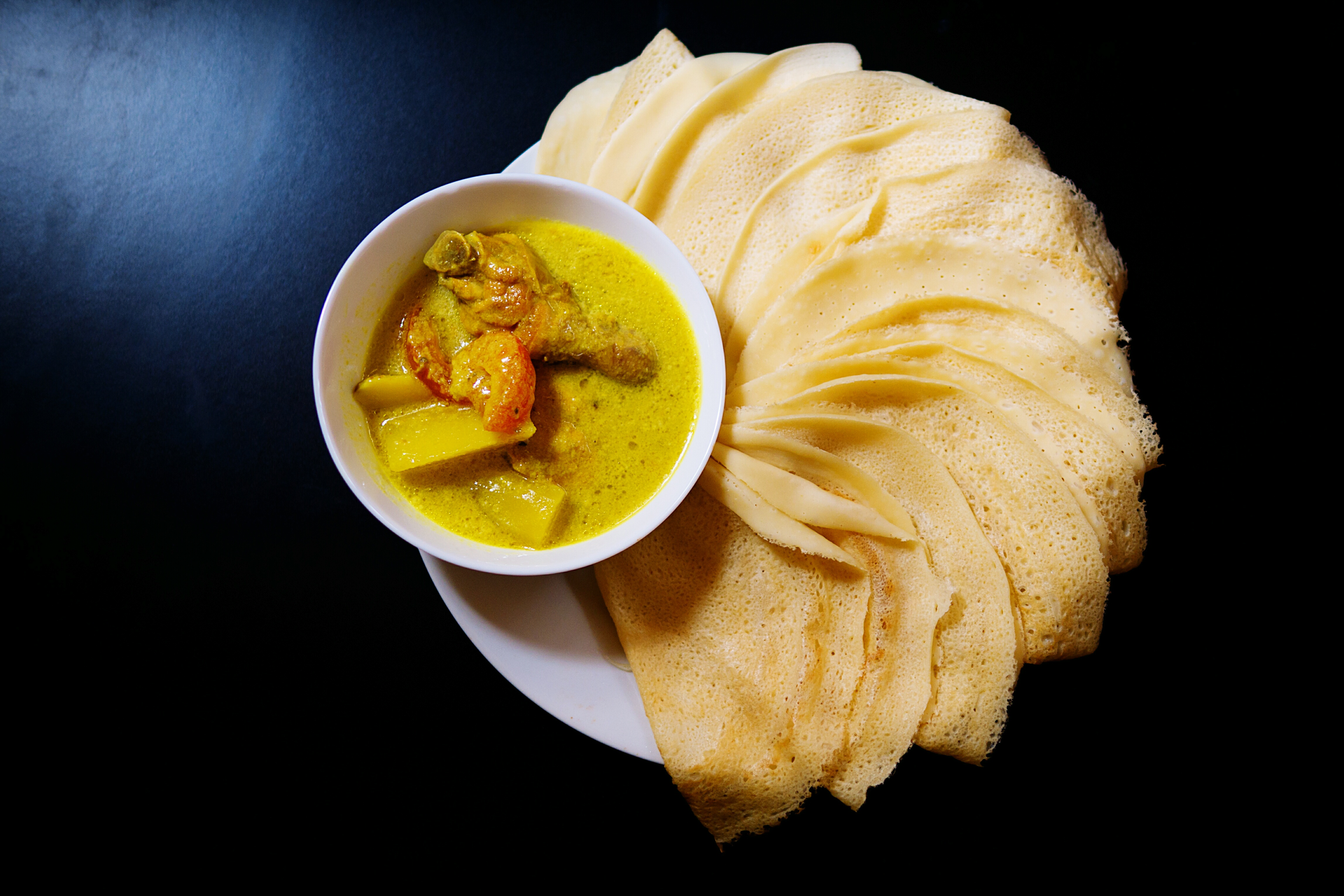 Overhead flat-lay of all ingredients for Malaysian Roti Jala with Curry Chicken laid out on a kitchen surface.