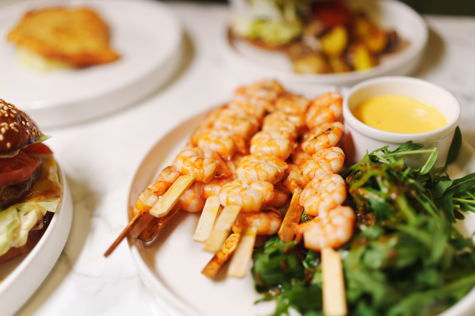 Malaysian Turmeric Coconut Shrimp Skewers with Citrus Dip — Appetizer served and photographed from above