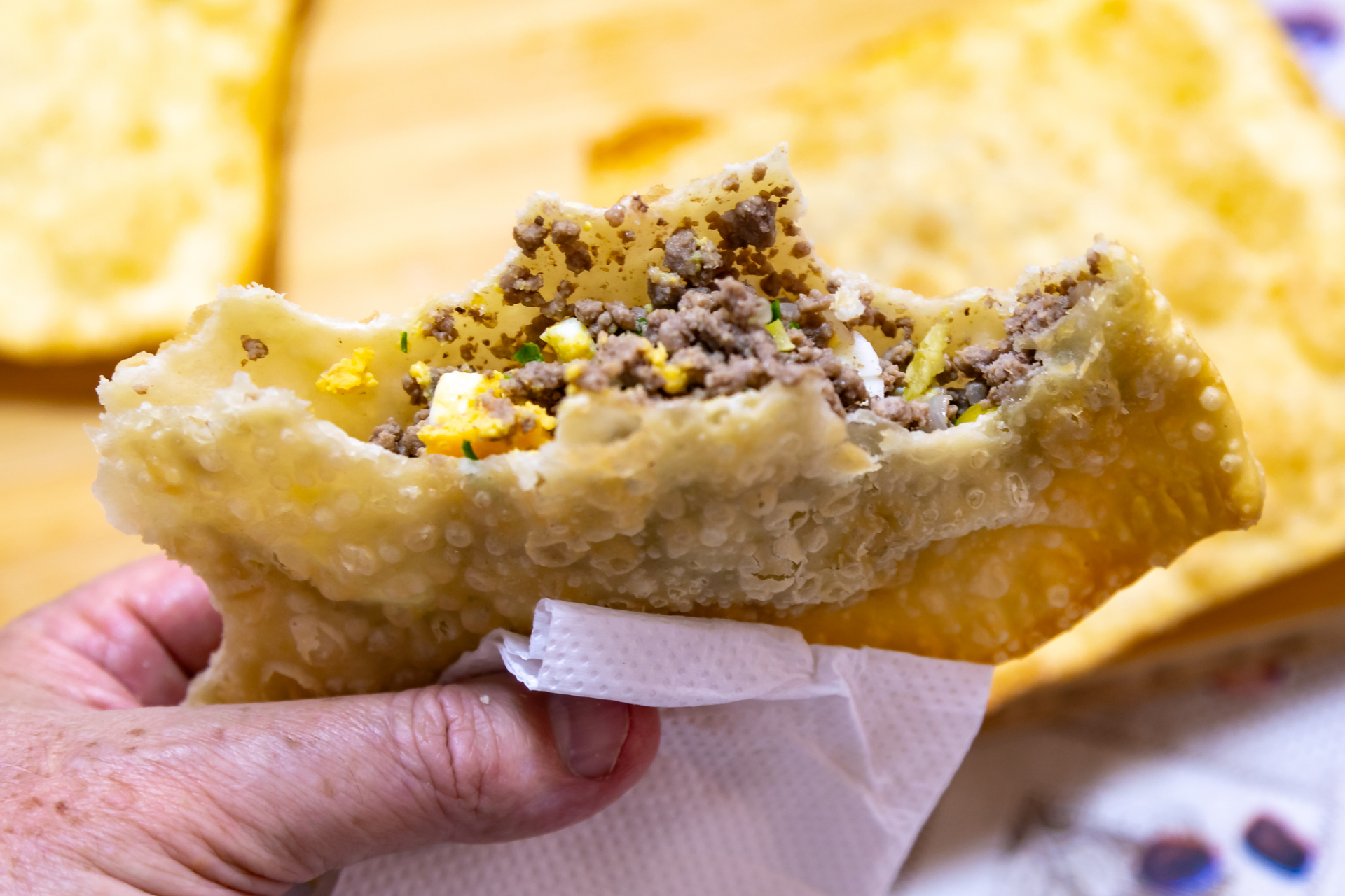 Overhead flat-lay of all ingredients for Maltese Pastizzis with Pea and Ricotta Filling laid out on a kitchen surface.