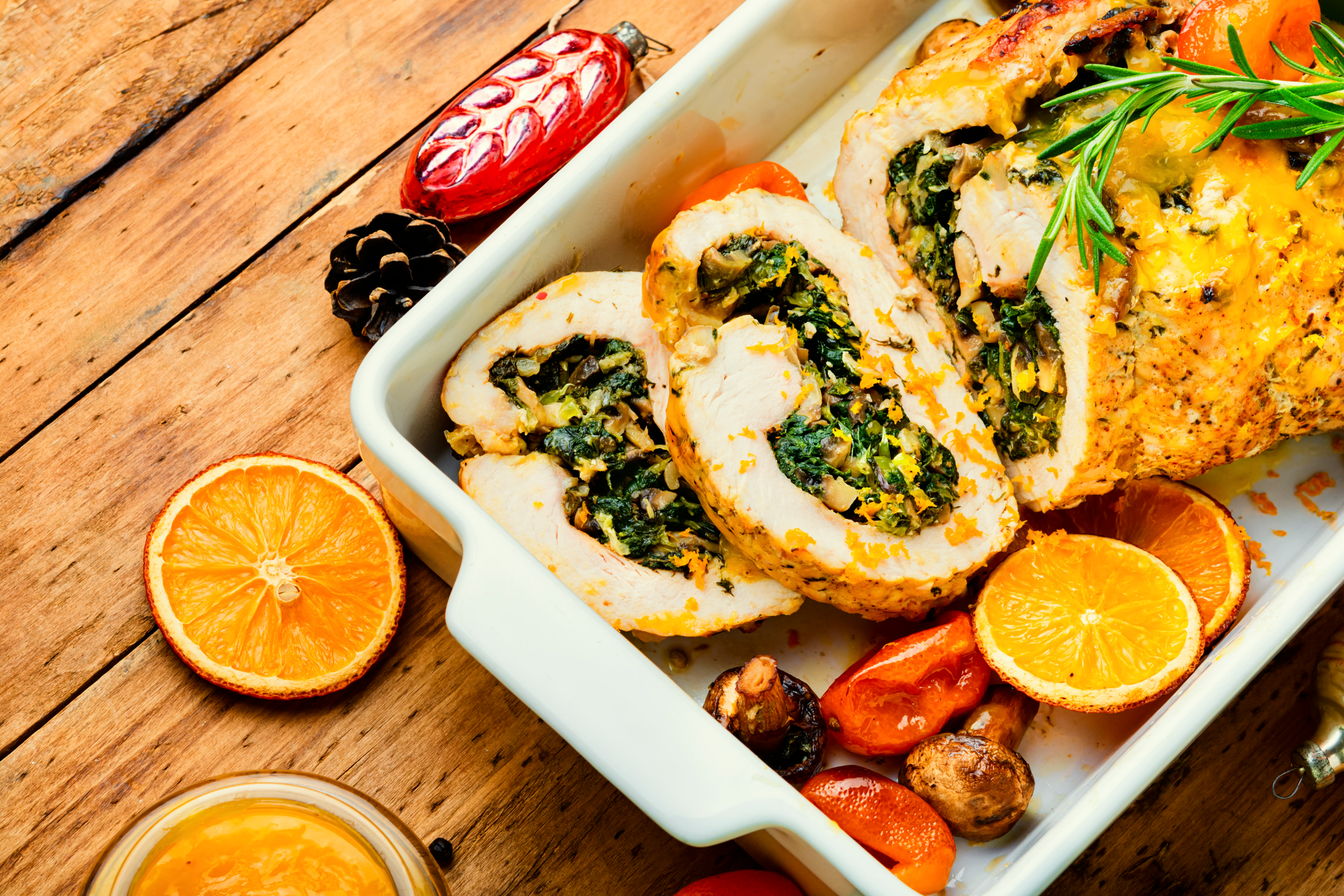 Overhead flat-lay of all ingredients for Mediterranean Olive-Tapenade Stuffed Chicken with Lemon Orzo laid out on a kitchen surface.
