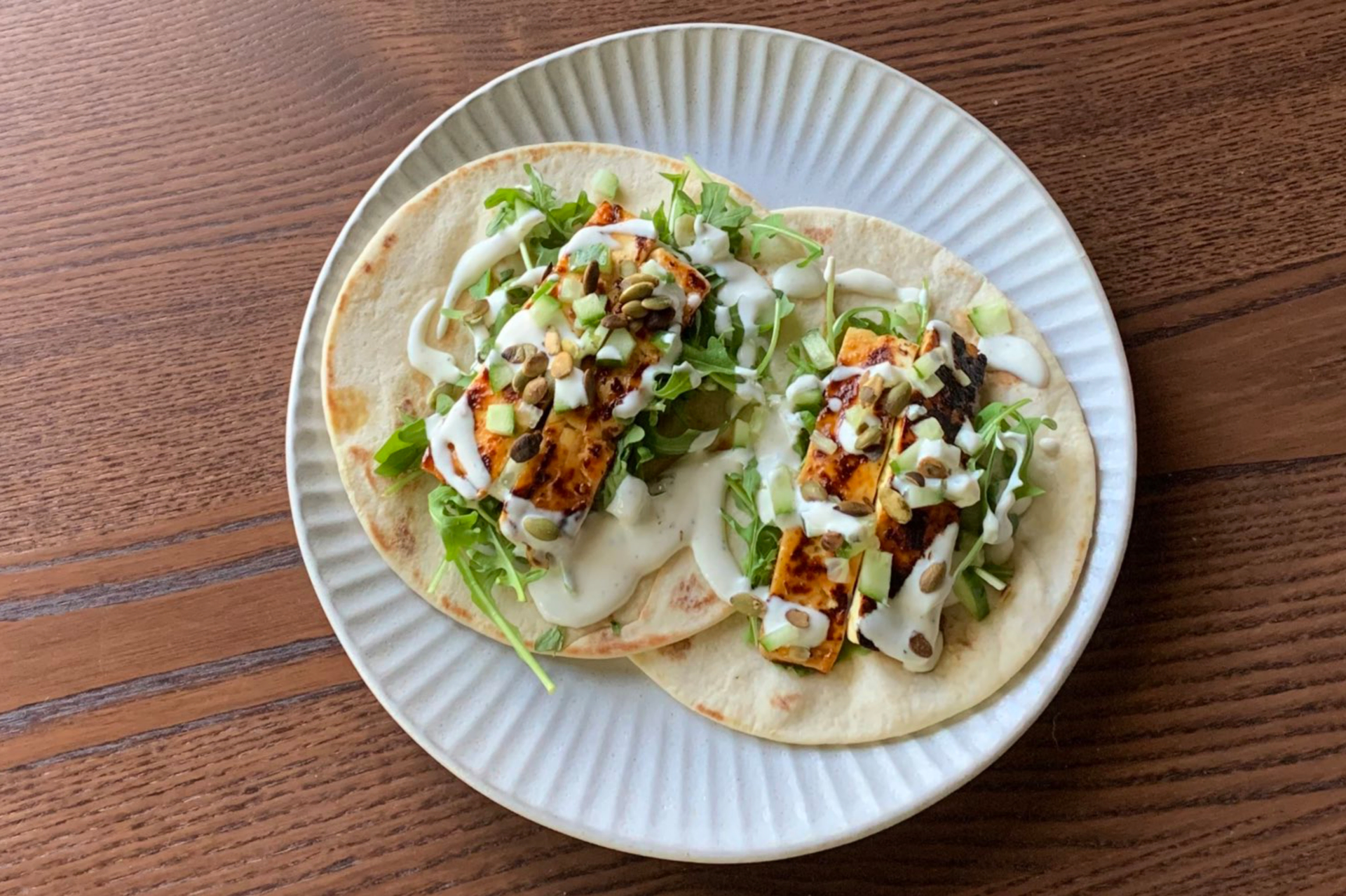 Overhead flat-lay of all ingredients for Mexican Charred Corn and Poblano Tacos with Chipotle Mayo laid out on a kitchen surface.