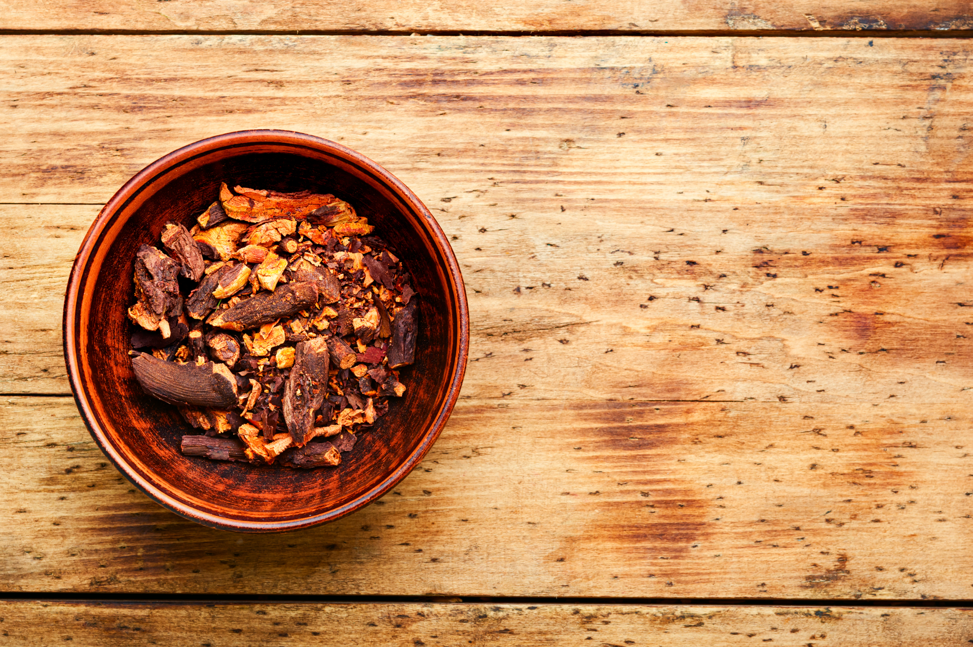 Overhead flat-lay of all ingredients for Mexican Chocolate Mole with Chicken and Almonds laid out on a kitchen surface.
