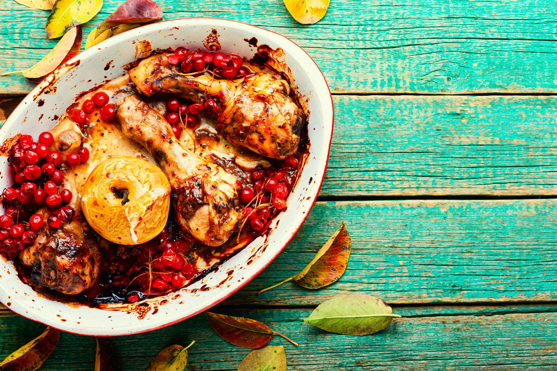 Overhead flat-lay of all ingredients for Middle Eastern Sumac-Roasted Chicken with Pomegranate Molasses Drizzle laid out on a kitchen surface.