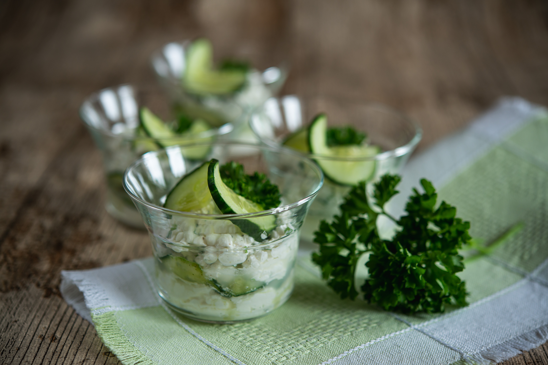 Overhead flat-lay of all ingredients for Minty Greek Cucumber Salsa with Feta and Dill laid out on a kitchen surface.