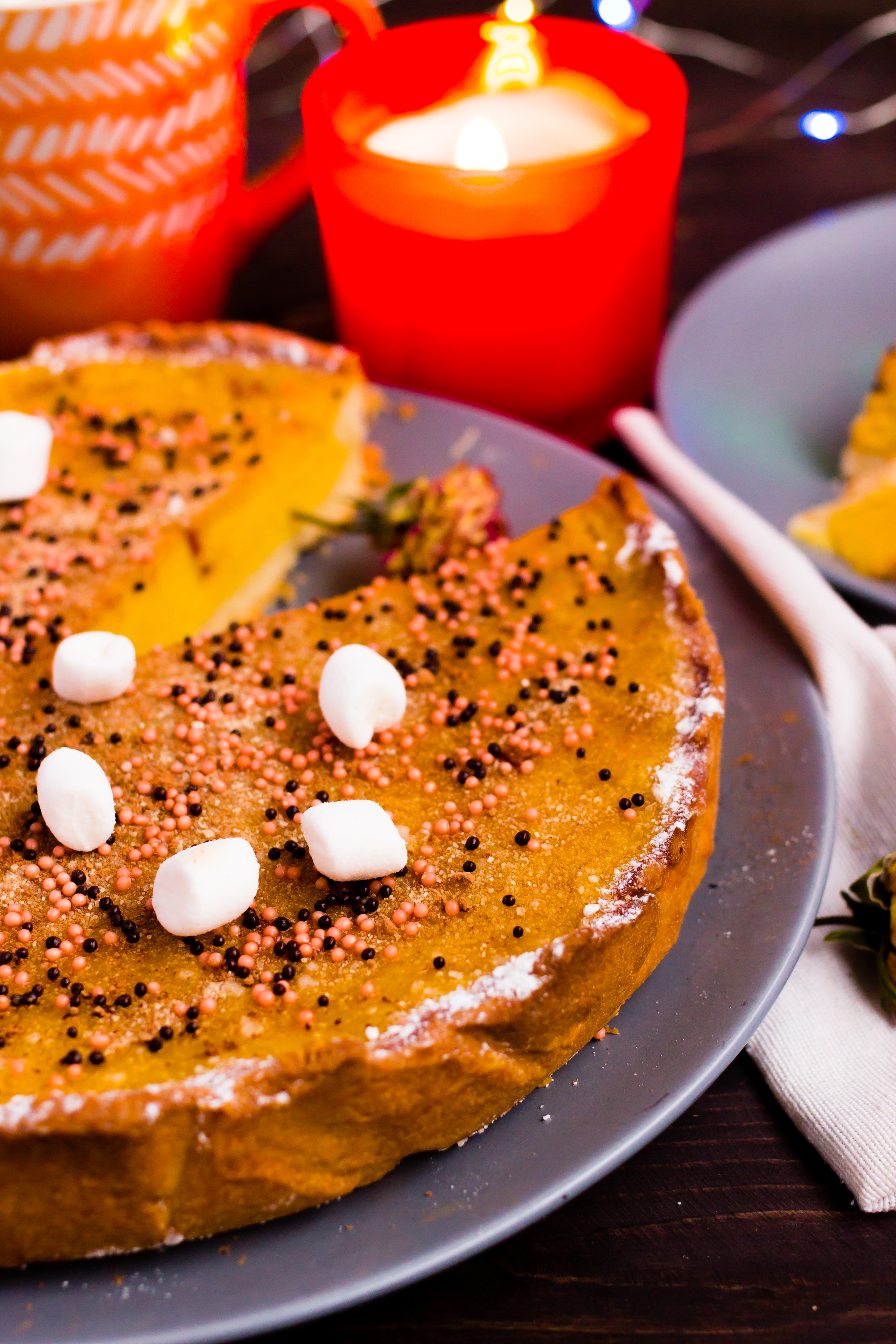 Overhead flat-lay of all ingredients for Moroccan Almond-Spiced Date Cake with Orange Zest Glaze laid out on a kitchen surface.