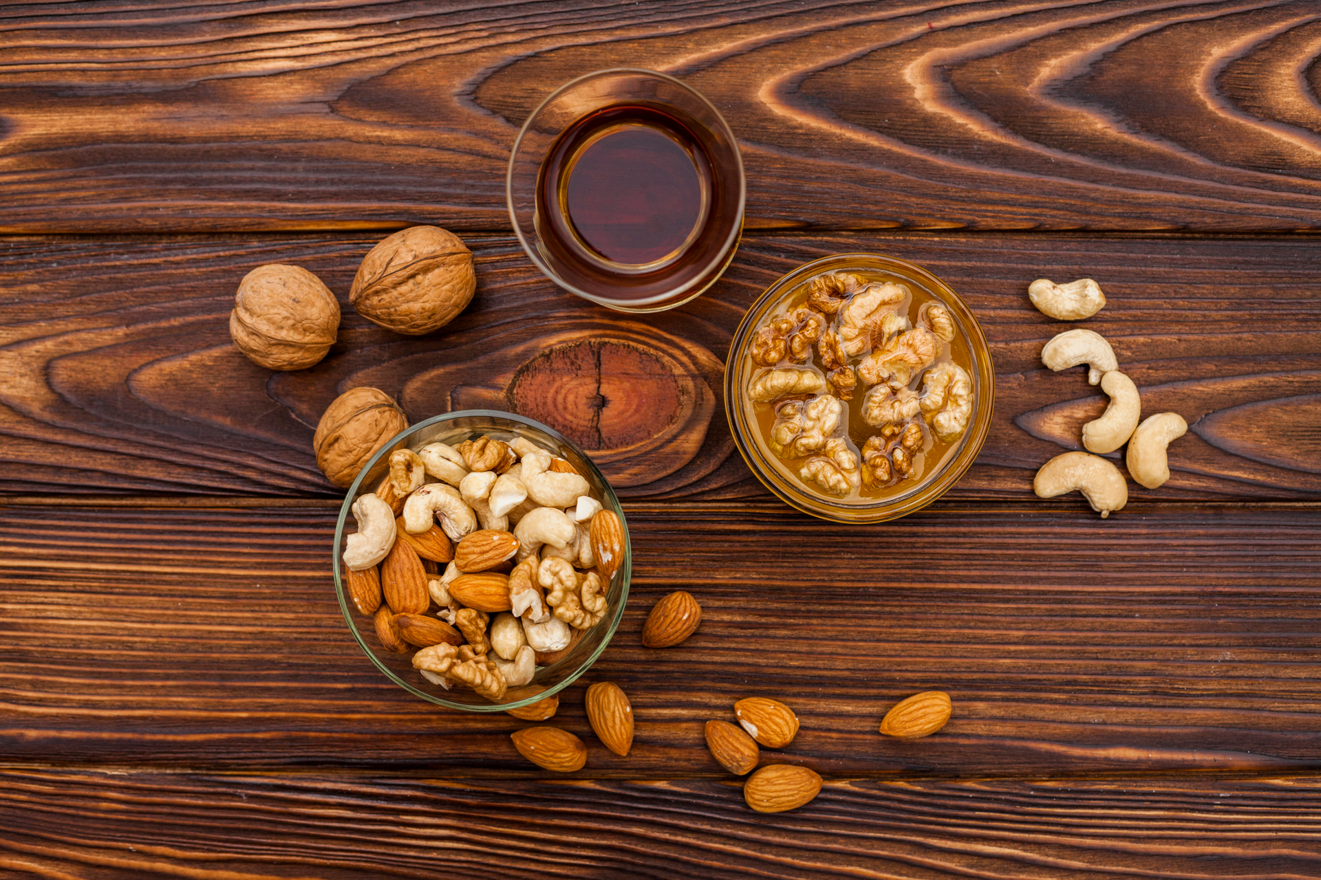 Overhead flat-lay of all ingredients for Moroccan Amlou with Almonds and Argan Oil laid out on a kitchen surface.