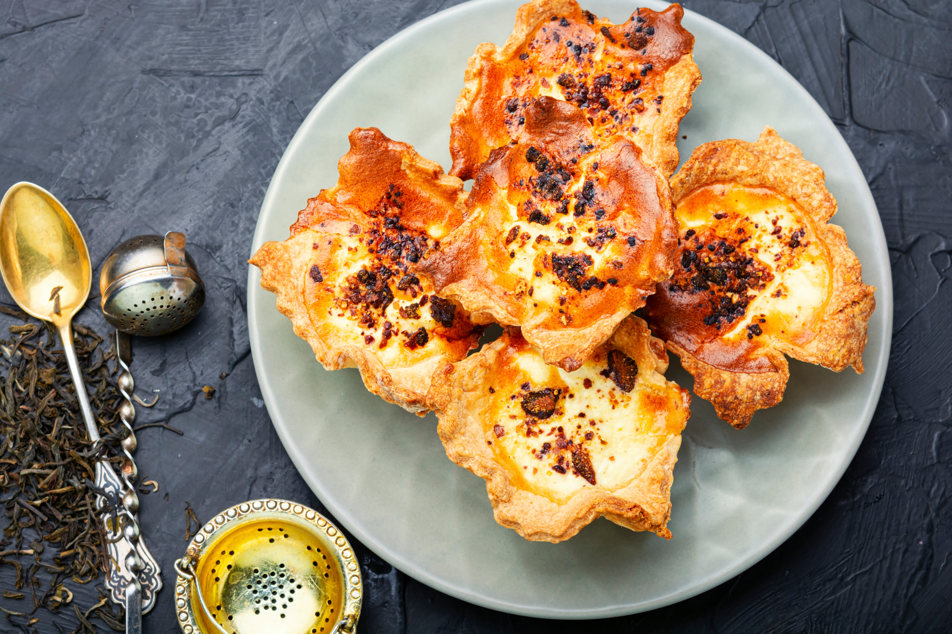 Overhead flat-lay of all ingredients for Moroccan Anise Briouats with Honey Glaze laid out on a kitchen surface.