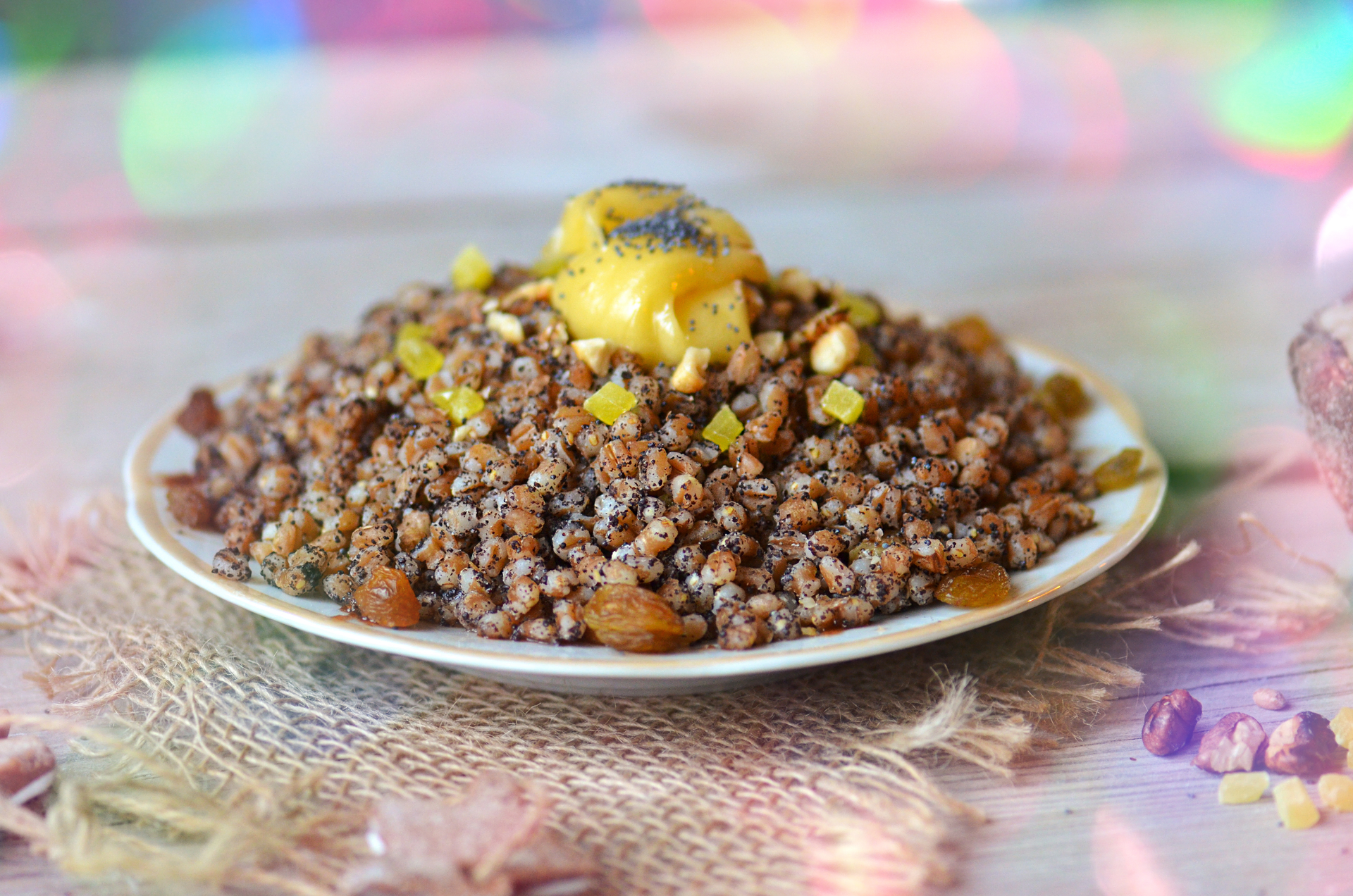 Overhead flat-lay of all ingredients for Moroccan Berber Wheat Couscous with Saffron and Raisins laid out on a kitchen surface.