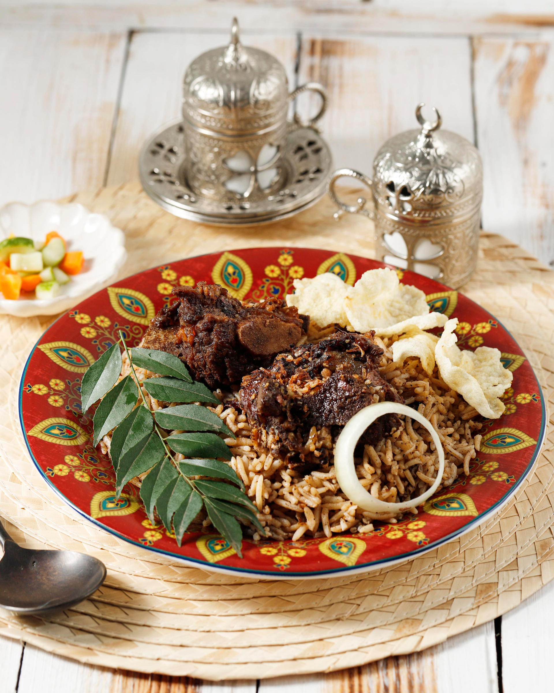 Overhead flat-lay of all ingredients for Moroccan Chermoula-Marinated Seitan Kabobs with Raisin Couscous laid out on a kitchen surface.