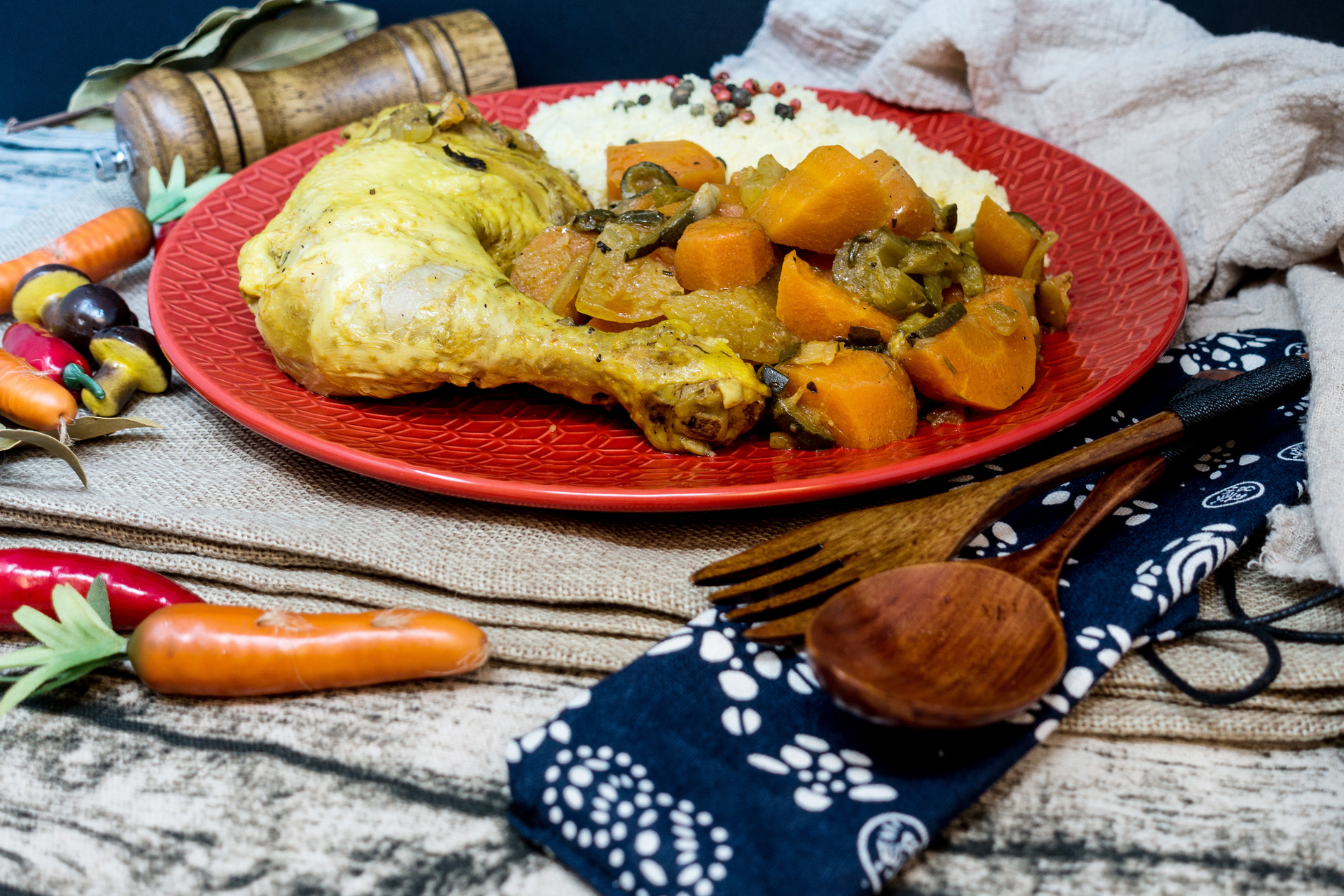 Overhead flat-lay of all ingredients for Moroccan Chicken Tagine laid out on a kitchen surface.