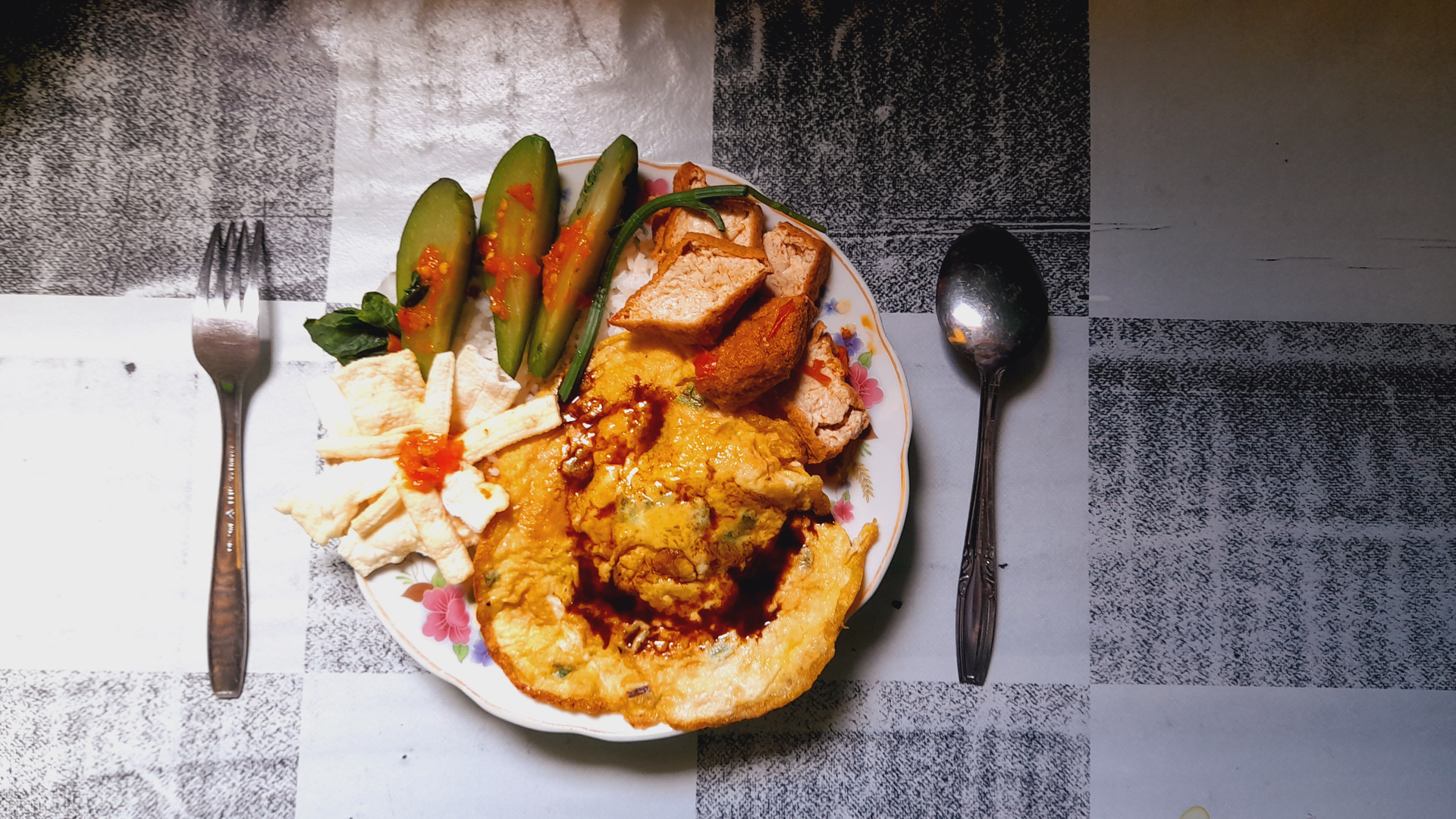 Overhead flat-lay of all ingredients for Moroccan Date and Harissa Chicken with Toasted Almonds laid out on a kitchen surface.