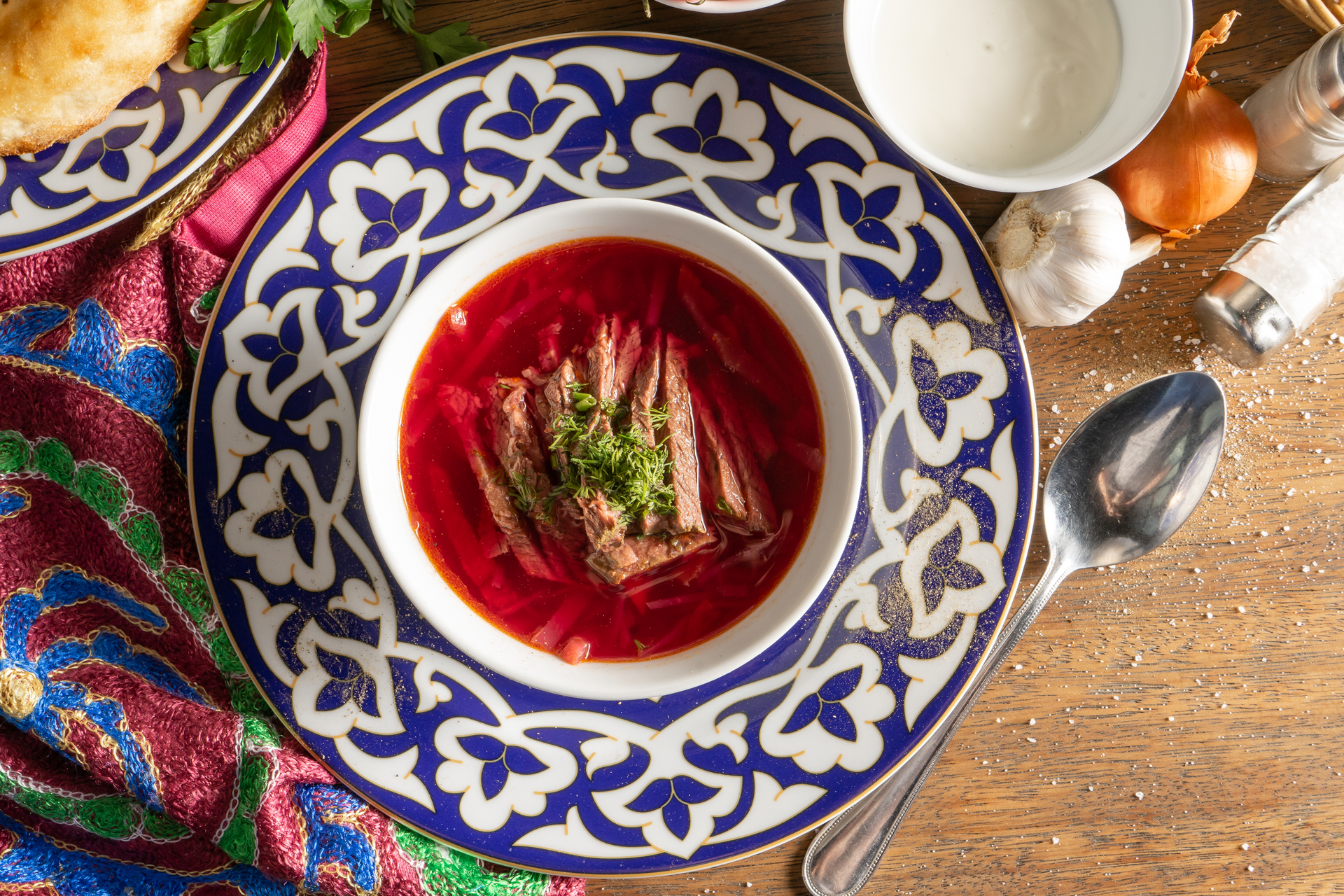 Overhead flat-lay of all ingredients for Moroccan Harira with Lamb and Saffron laid out on a kitchen surface.