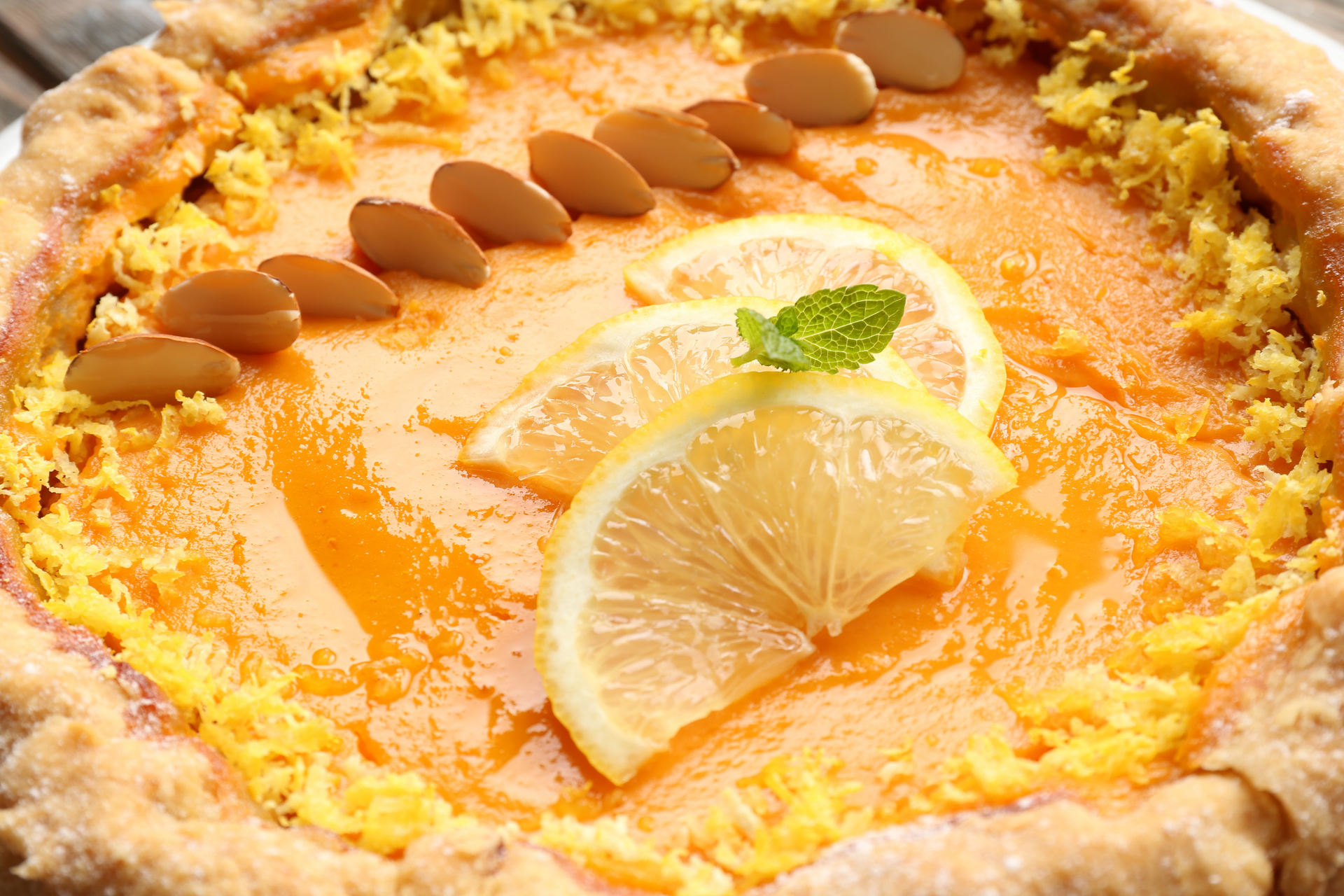 Overhead flat-lay of all ingredients for Moroccan Orange Blossom Cake with Almond Buttercream laid out on a kitchen surface.