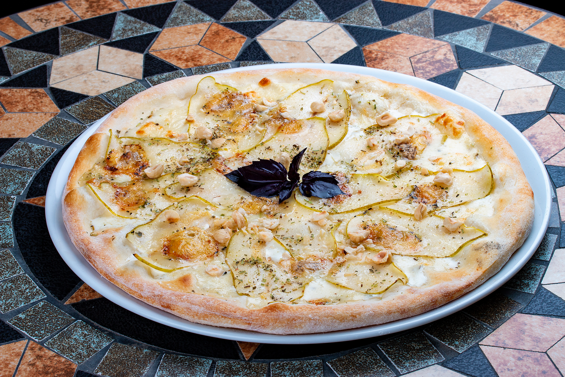Overhead flat-lay of all ingredients for Moroccan Preserved Lemon and Olive Chicken Pizza laid out on a kitchen surface.