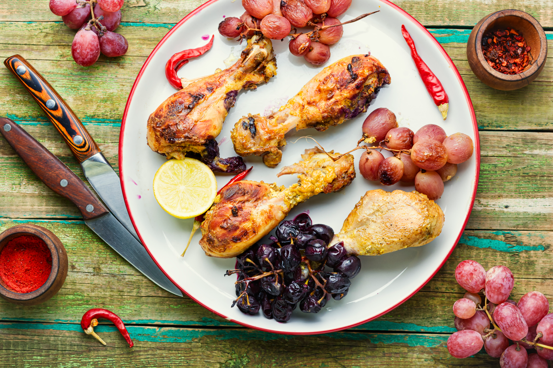 Overhead flat-lay of all ingredients for Moroccan Preserved Lemon and Olive Oregano Chicken Skewers laid out on a kitchen surface.