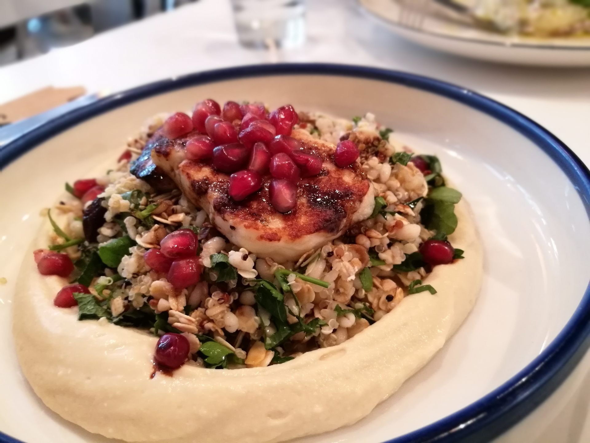 Moroccan Quinoa Couscous with Figs and Harissa Vinaigrette — Main Course served and photographed from above