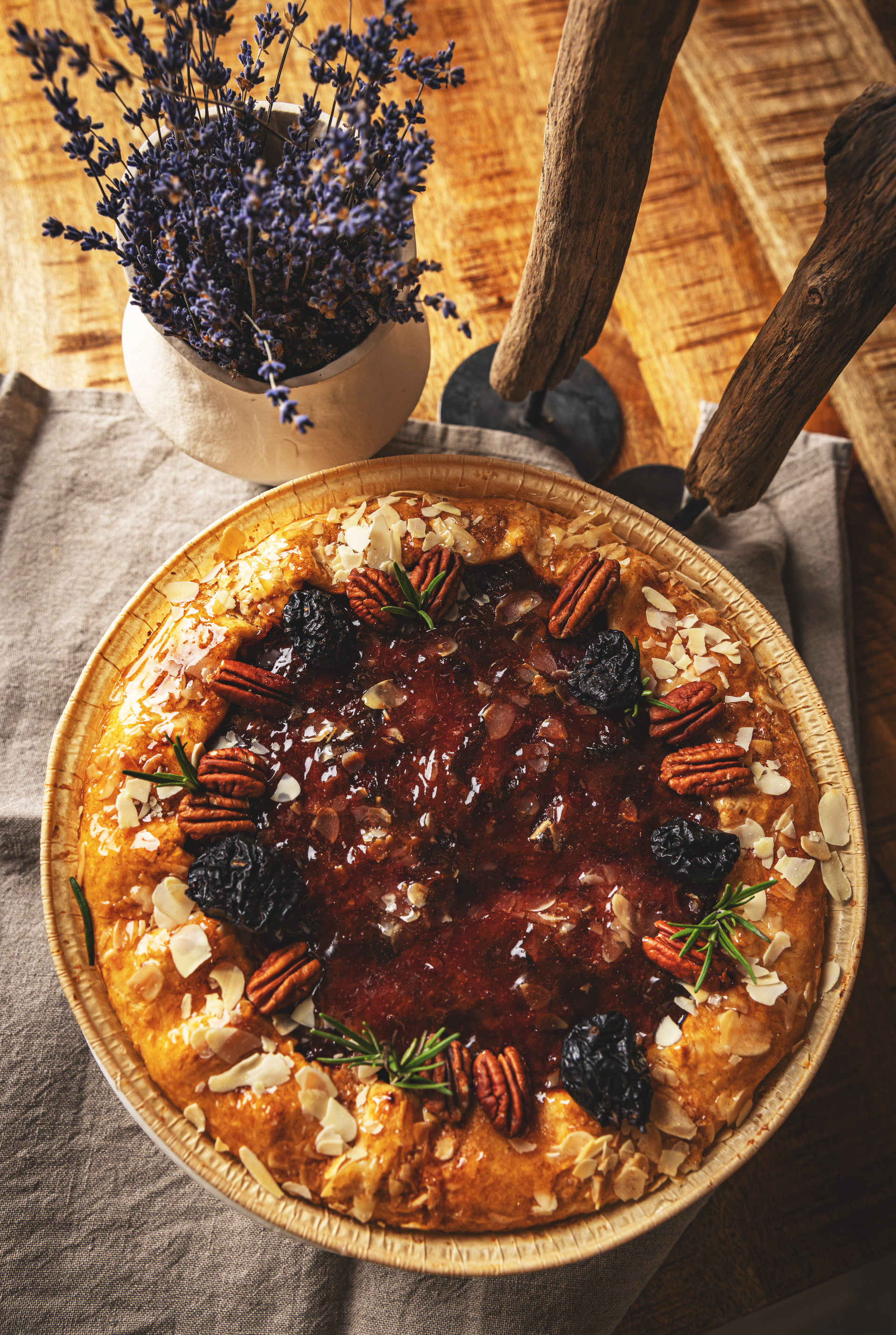 Overhead flat-lay of all ingredients for Moroccan Spiced Date and Orange Tart with Cinnamon Almond Crunch laid out on a kitchen surface.