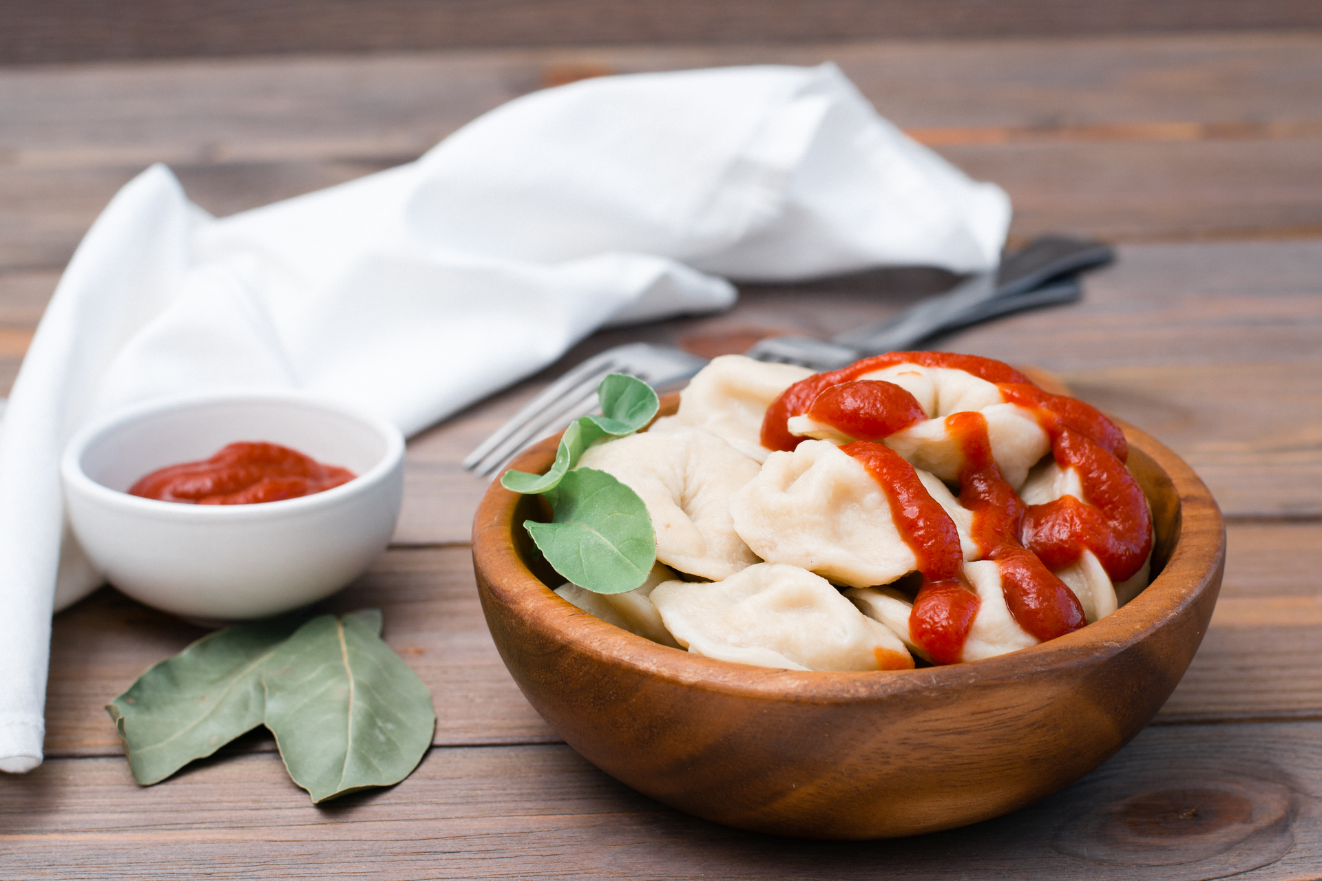 Overhead flat-lay of all ingredients for Nepalese Momo with Spicy Tomato Chutney laid out on a kitchen surface.