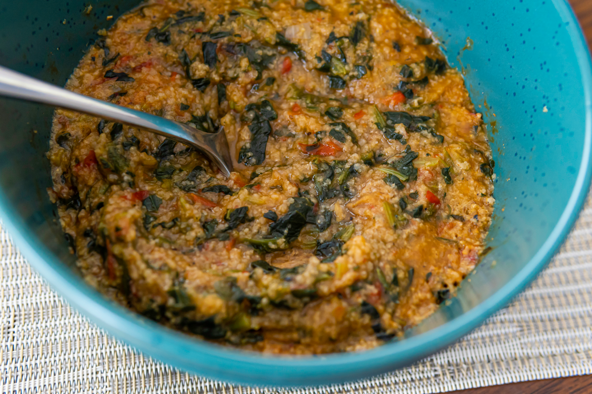Nigerian Egusi Soup with Spinach and Melon Seeds — Main Course served and photographed from above